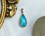 BEZEL SET ETHIOPIAN OPAL PENDANT IN 14K YELLOW GOLD-2