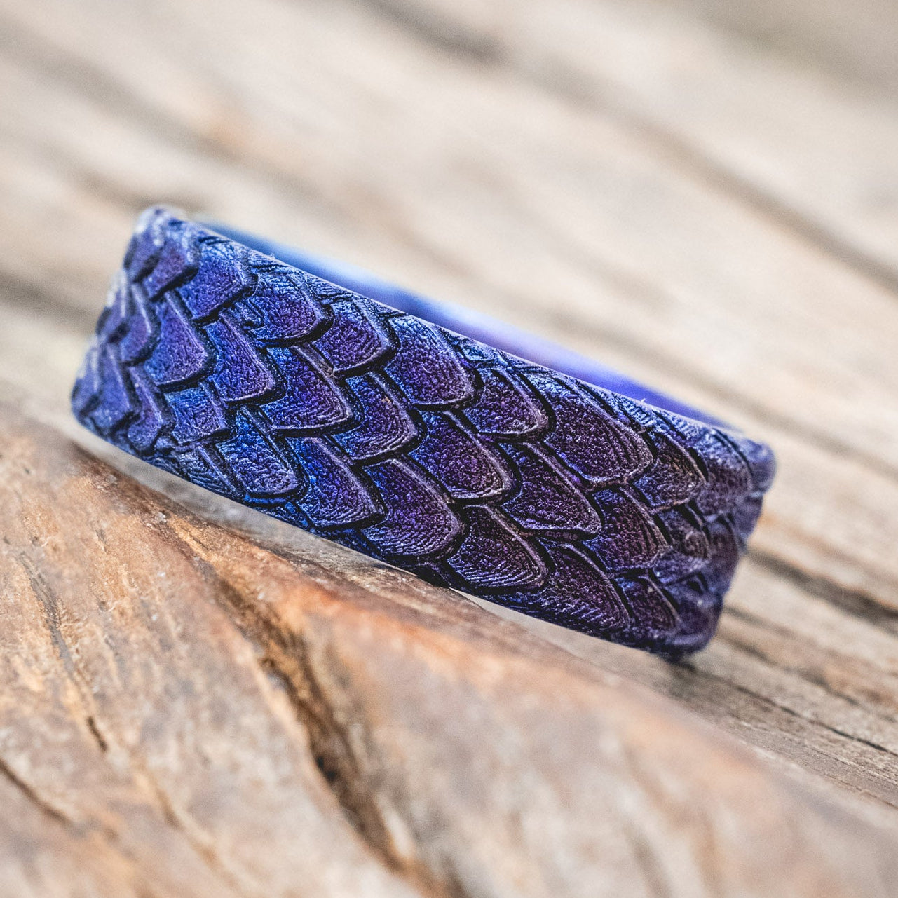"Echo" thicker wedding band featuring fire-treated titanium with a custom embossed 3D dragon scale