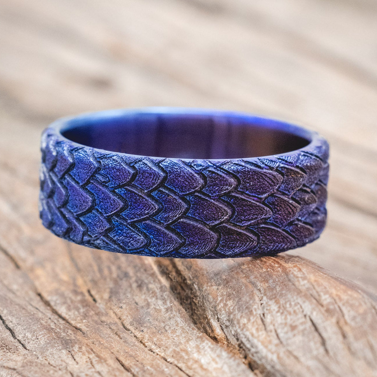 "Echo" thicker wedding band featuring fire-treated titanium with a custom embossed 3D dragon scale