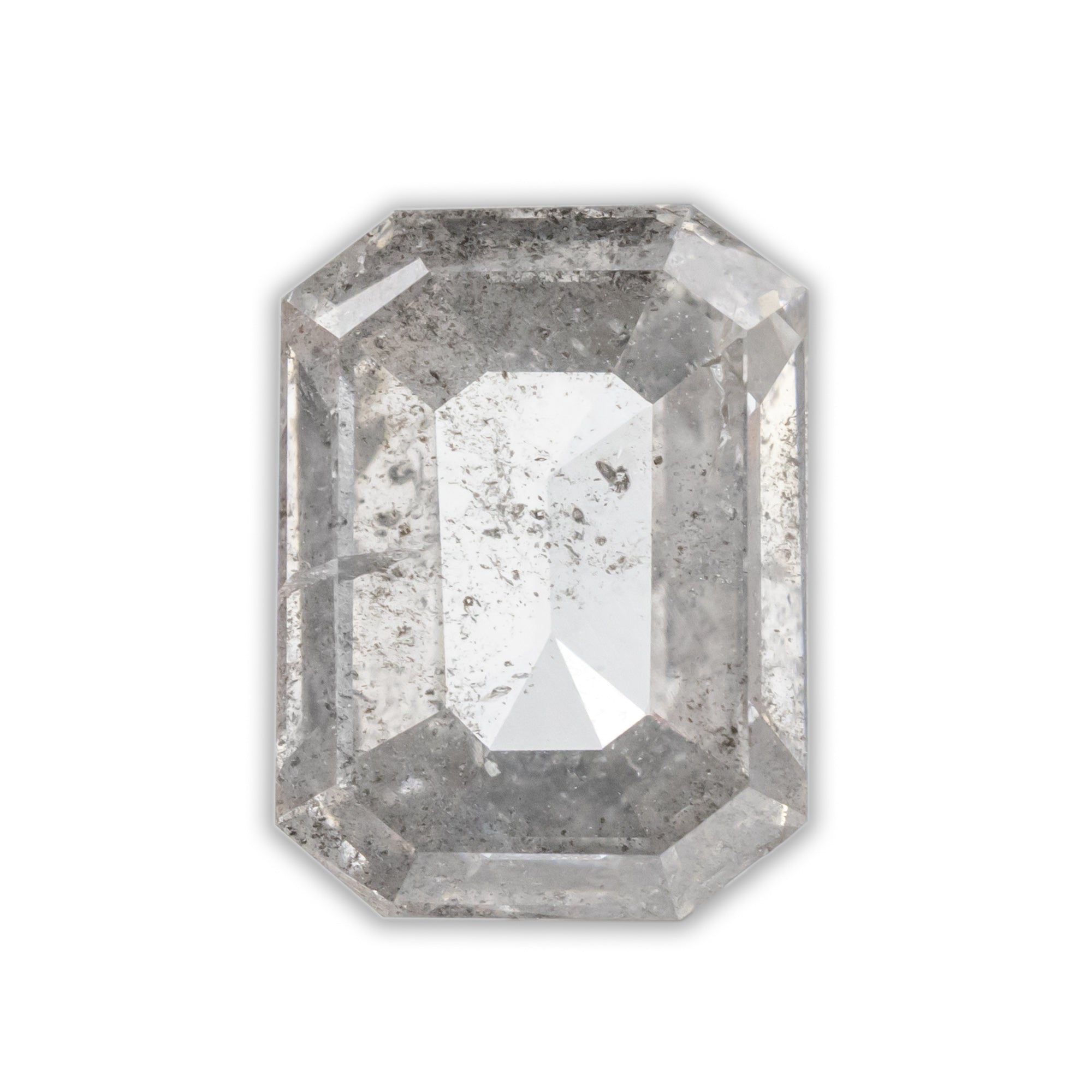 An emerald cut salt & pepper diamond on a white background