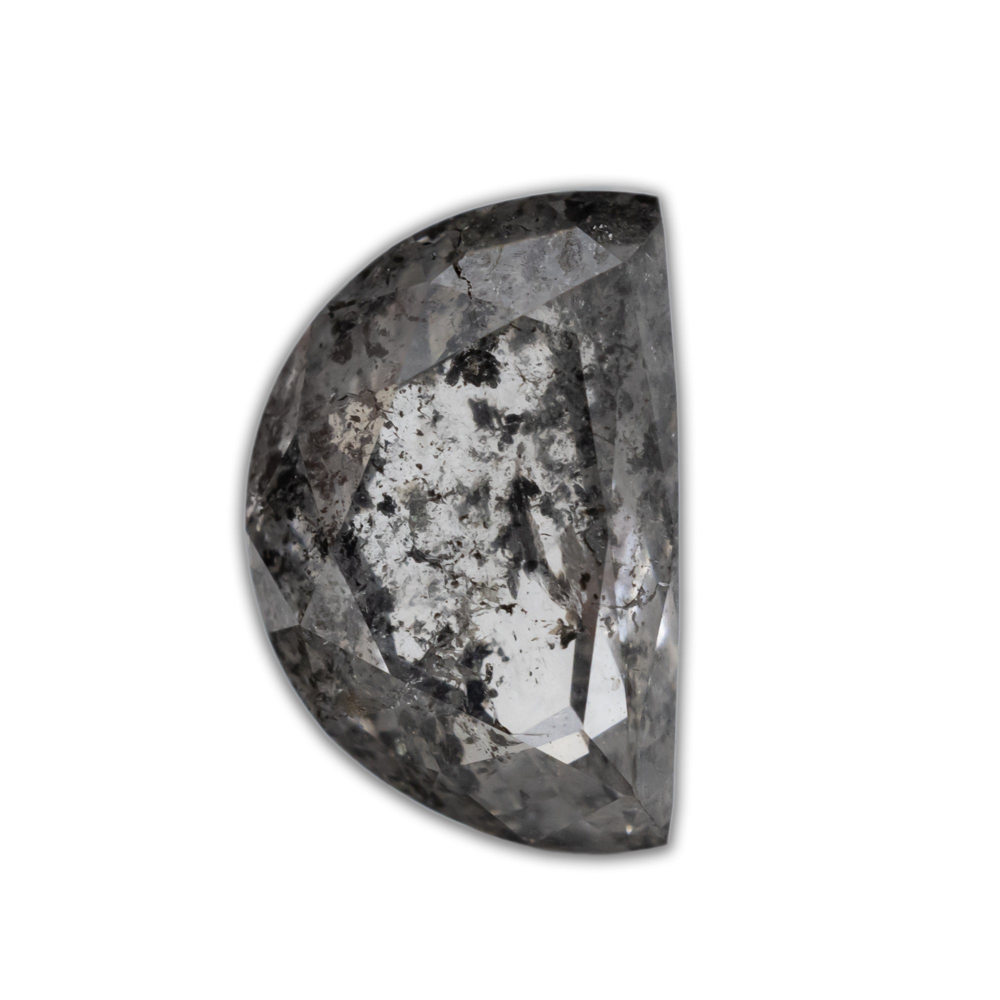 A half moon salt & pepper diamond with black inclusions on a white background.
