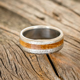 "NIRVANA" - CENTERED WHISKEY BARREL INLAY WEDDING BAND WITH HAMMERED FINISH