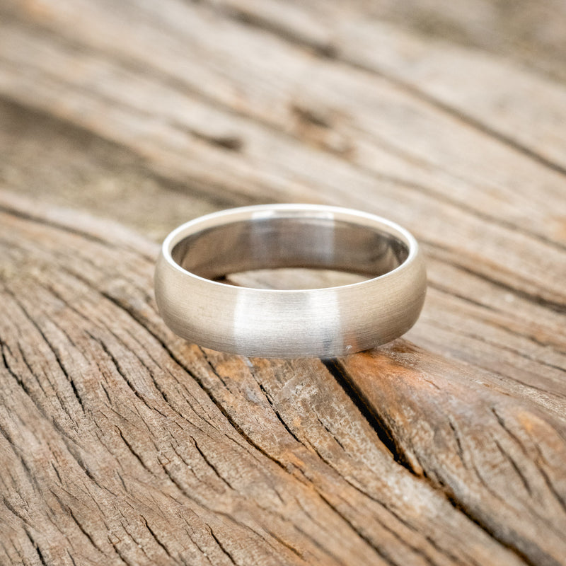 DOMED SOLID METAL WEDDING BAND WITH A BRUSHED FINISH
