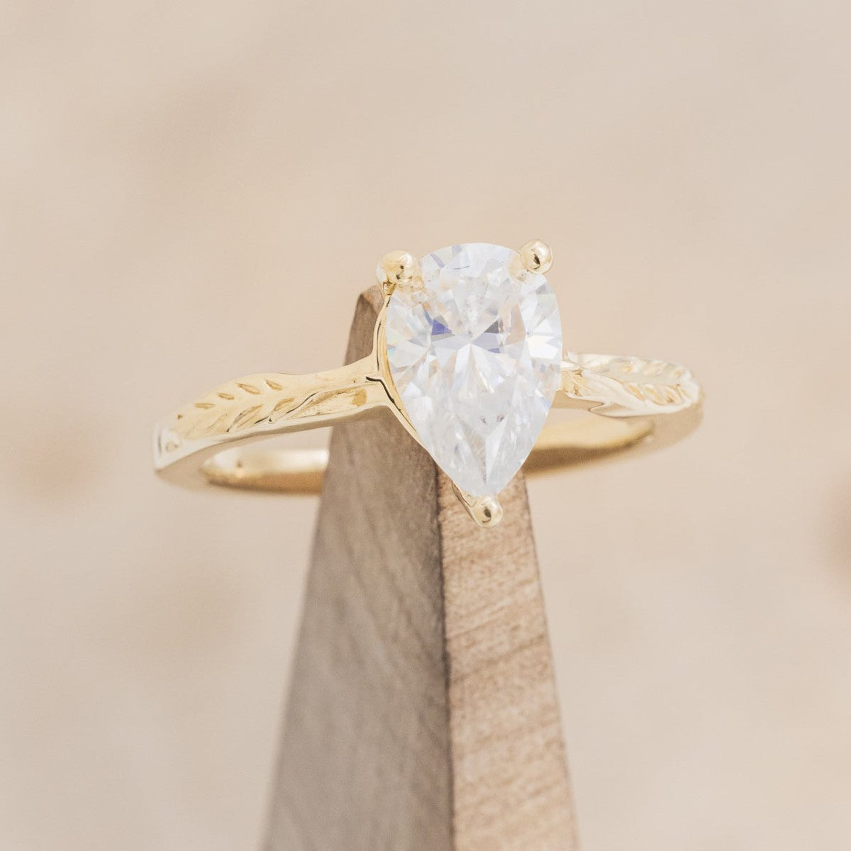 "HOPE" - PEAR-SHAPED MOISSANITE SOLITAIRE ENGAGEMENT RING WITH FEATHER ACCENTS-1