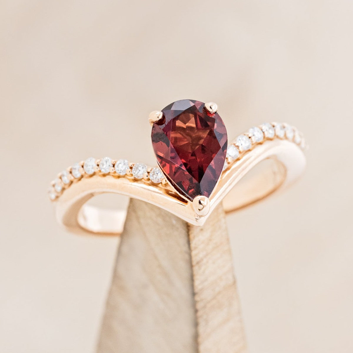 "IO" - PEAR-SHAPED GARNET ENGAGEMENT RING WITH DIAMOND ACCENTS-1