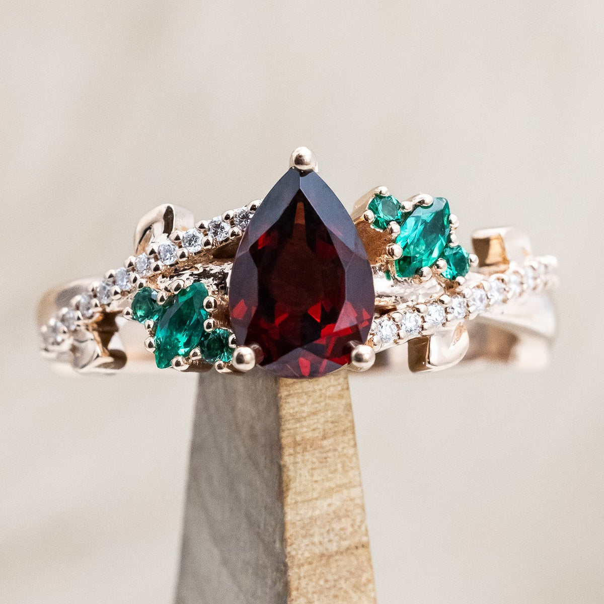 "KAMILA" - PEAR CUT MOZAMBIQUE GARNET ENGAGEMENT RING WITH EMERALD & DIAMOND ACCENTS-Staghead Designs