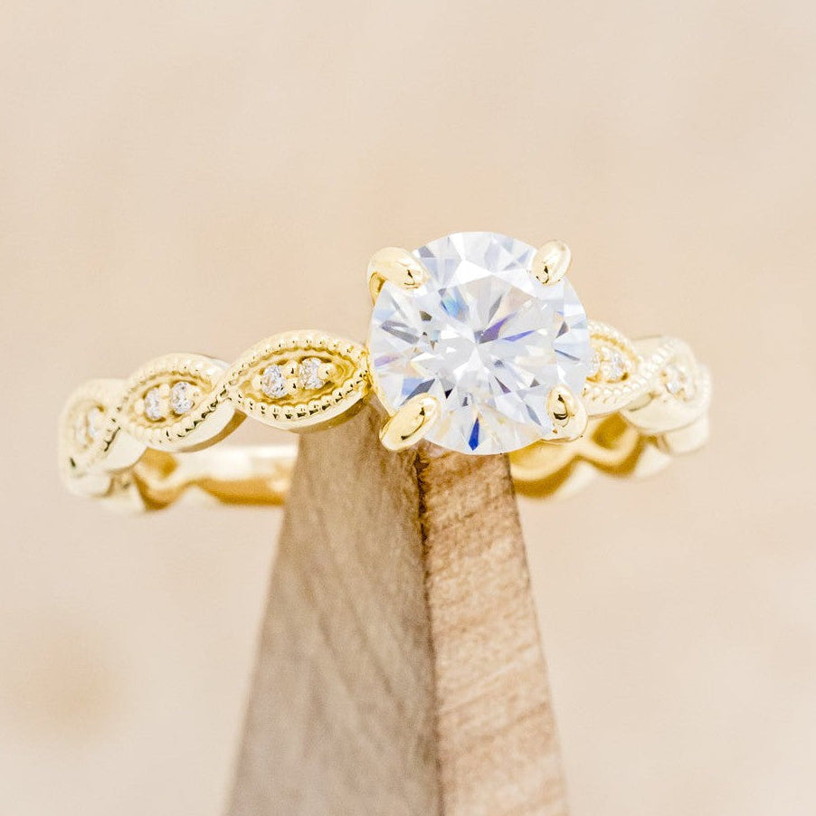 "NOUR" - ROUND CUT MOISSANITE ENGAGEMENT RING WITH DIAMOND ACCENTS-1