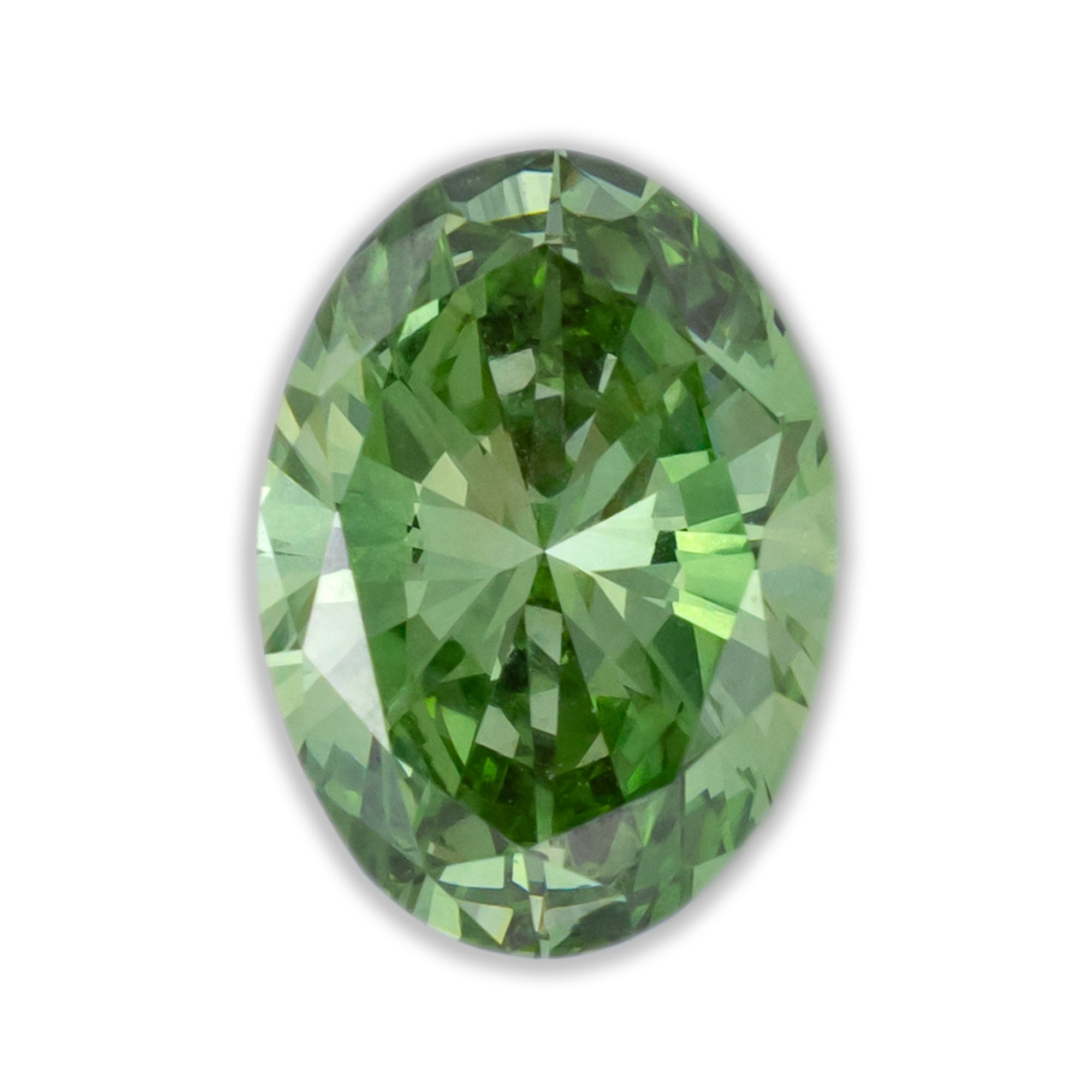 Oval cut vivid green lab diamond on a white surface.