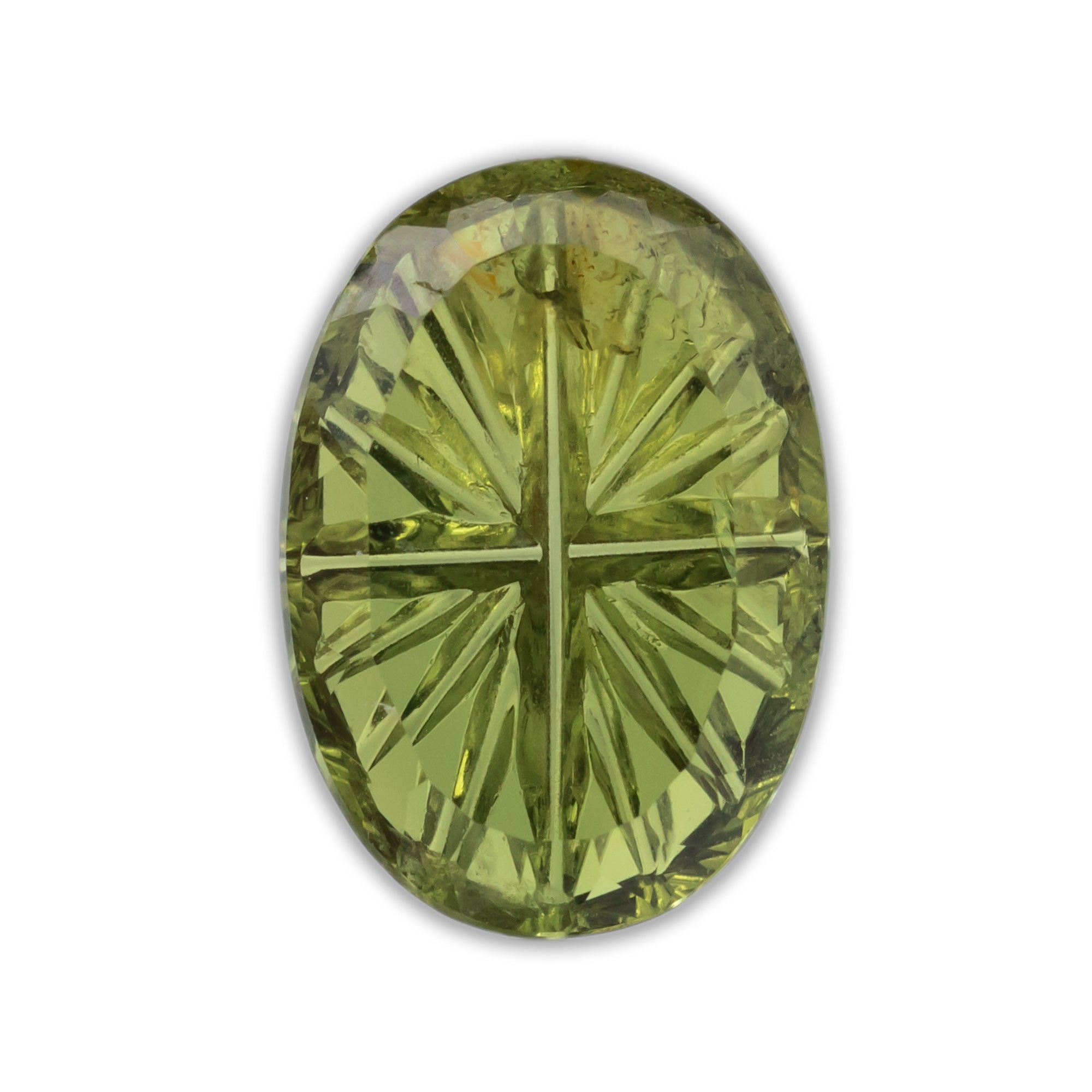 Oval cut green sapphire on a white background