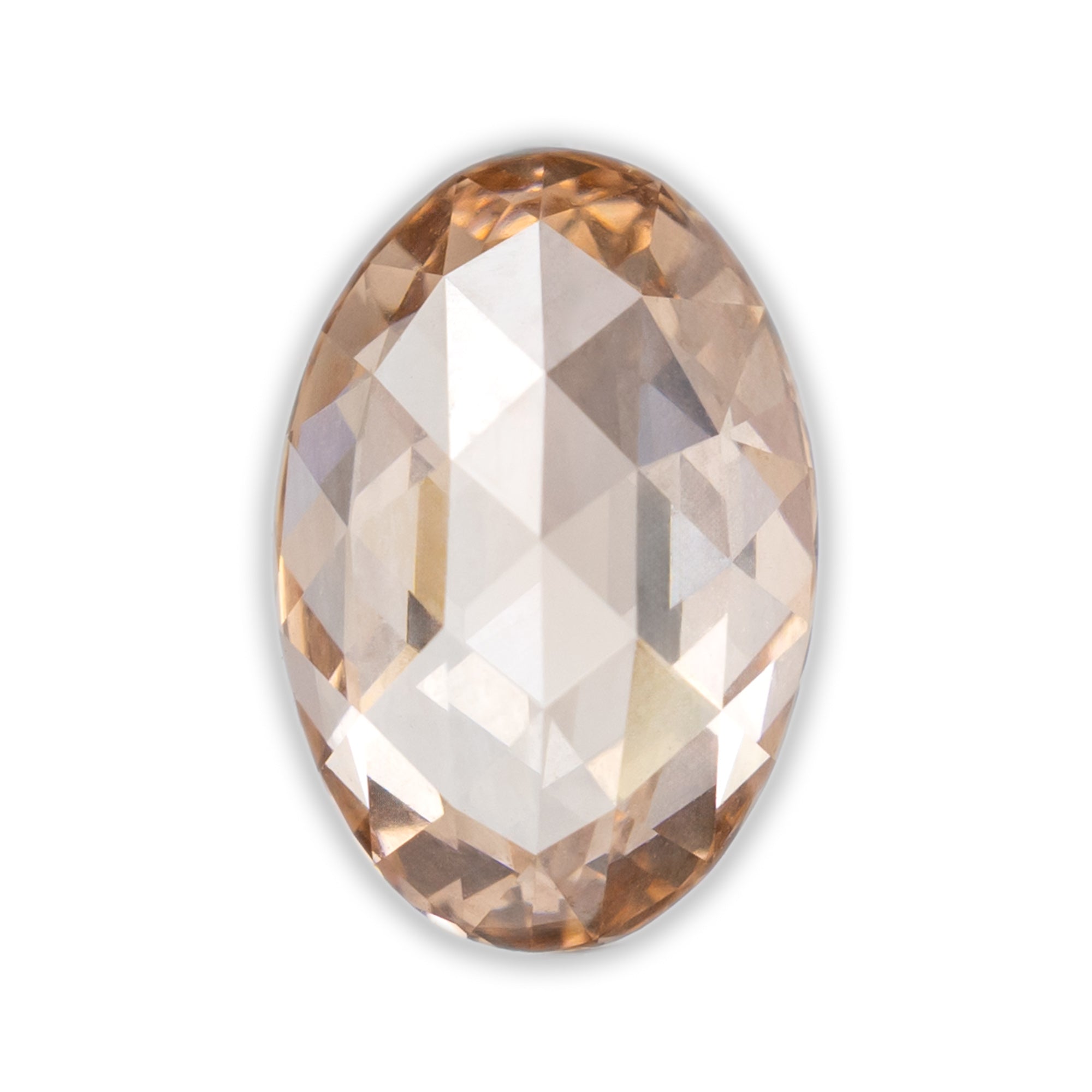 Facted oval champagne colored diamond on a white background