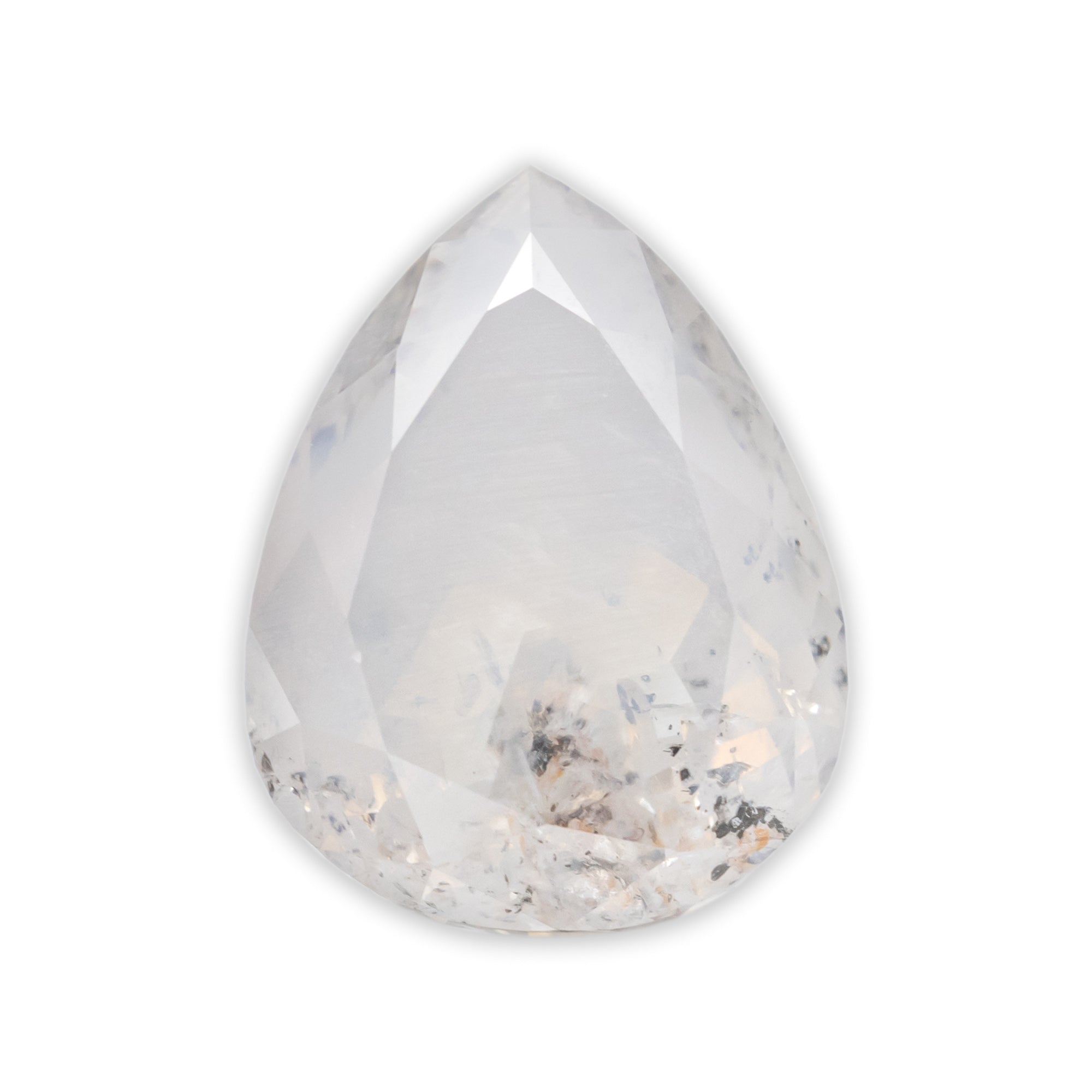 A pear cut salt & pepper diamond with natural inclusions on a white background 