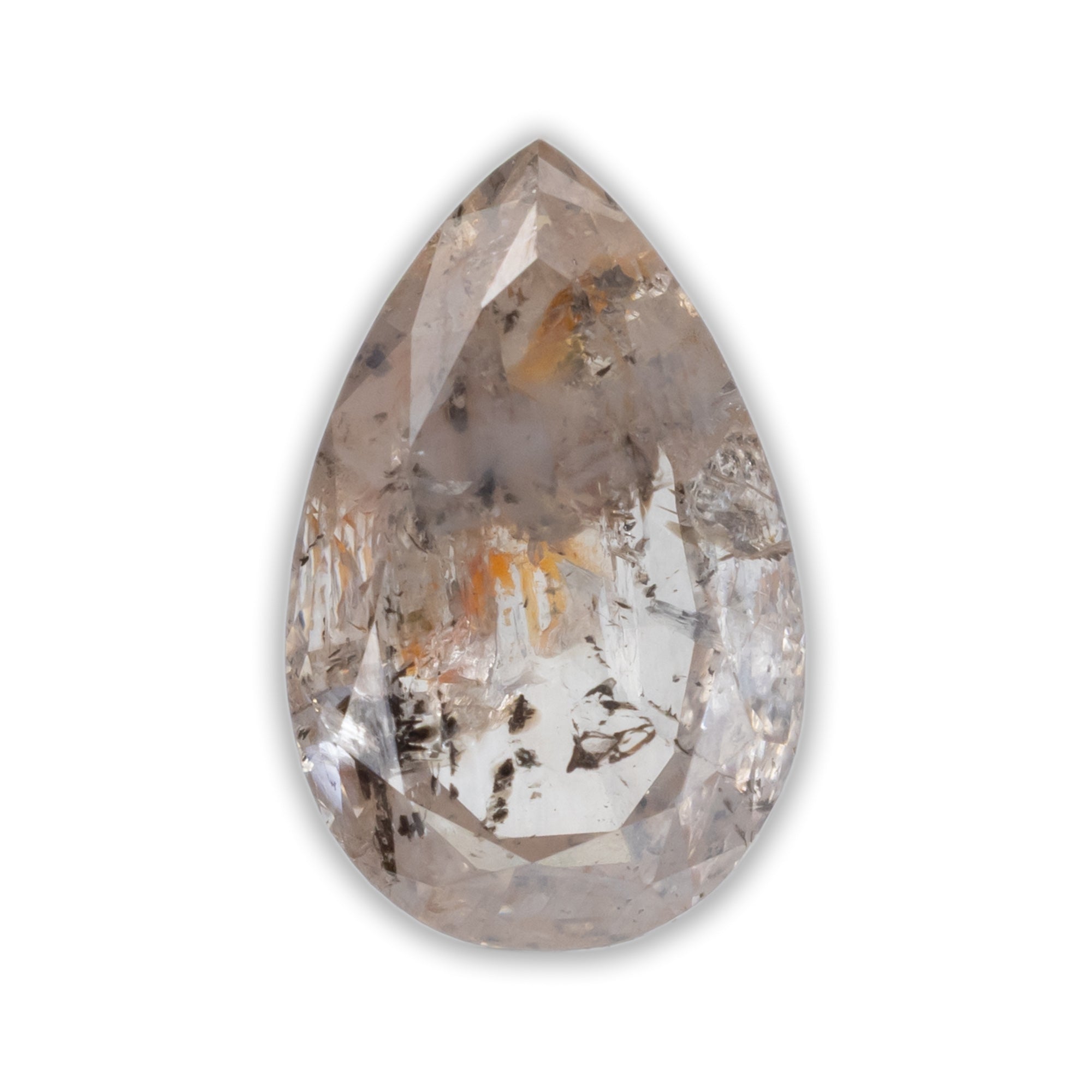 A pear cut salt & pepper diamond with speckled inclusions mon a white background and peach tinit