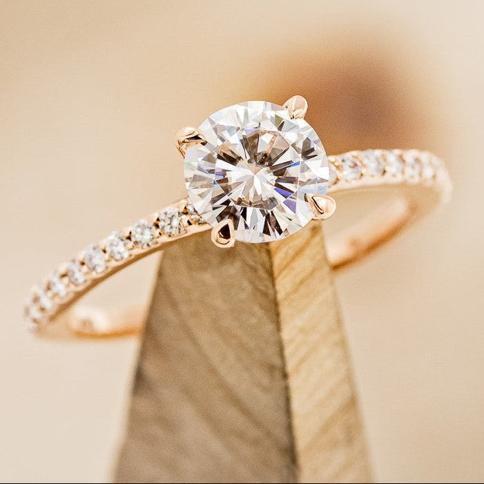 "RAMONA" - 4 PRONG ROUND CUT MOISSANITE ENGAGEMENT RING WITH DIAMOND ACCENTS