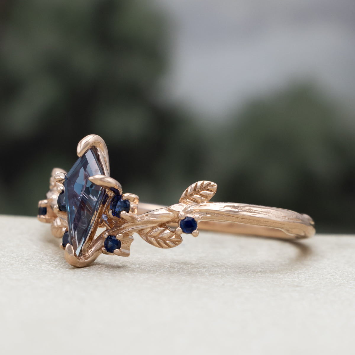 "Artemisia" - Kite Cut Lab-Grown Alexandrite Engagement Ring With Blue Sapphire Accents-Staghead Designs