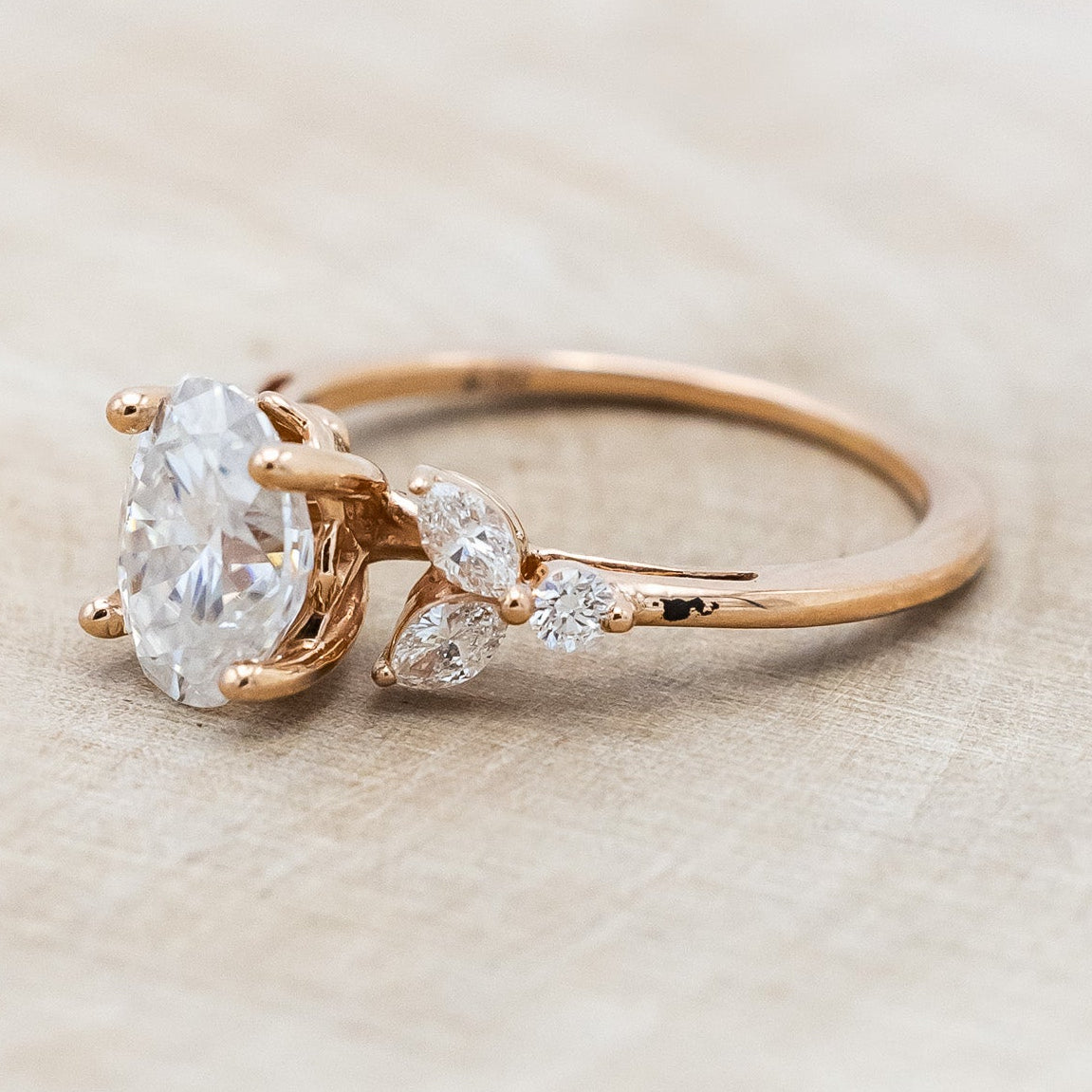 "BLOSSOM" - OVAL MOISSANITE ENGAGEMENT RING WITH LEAF-SHAPED DIAMOND ACCENTS-Staghead Designs