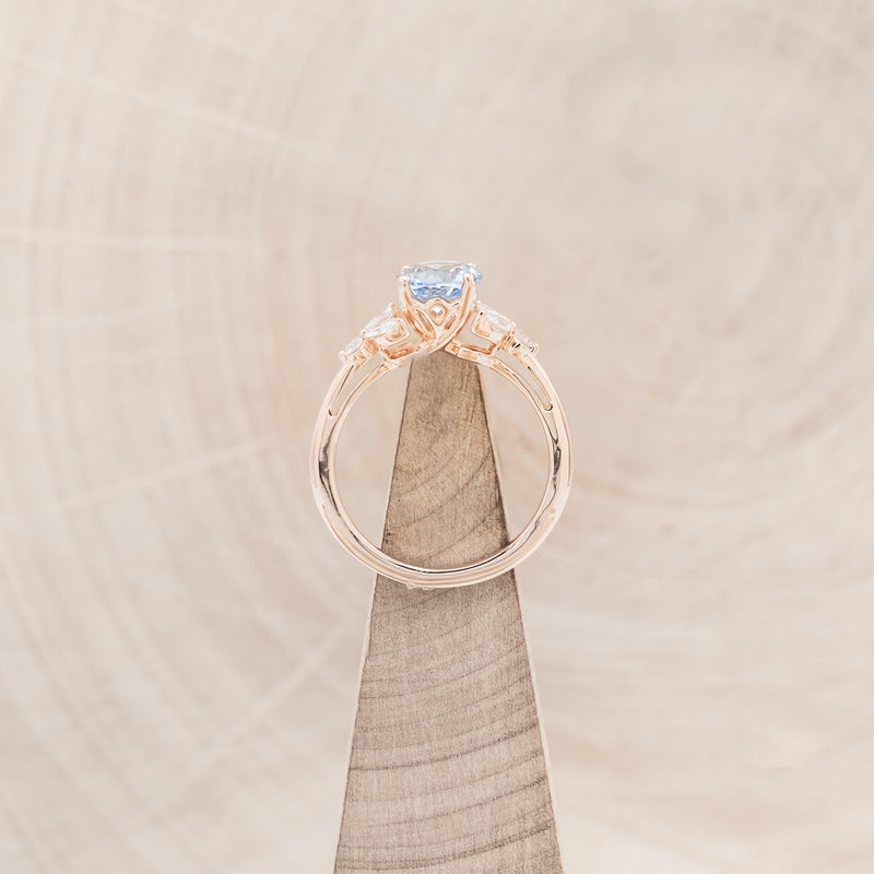 "BLOSSOM" - ROUND CUT AQUAMARINE ENGAGEMENT RING WITH LEAF-SHAPED DIAMOND ACCENTS
