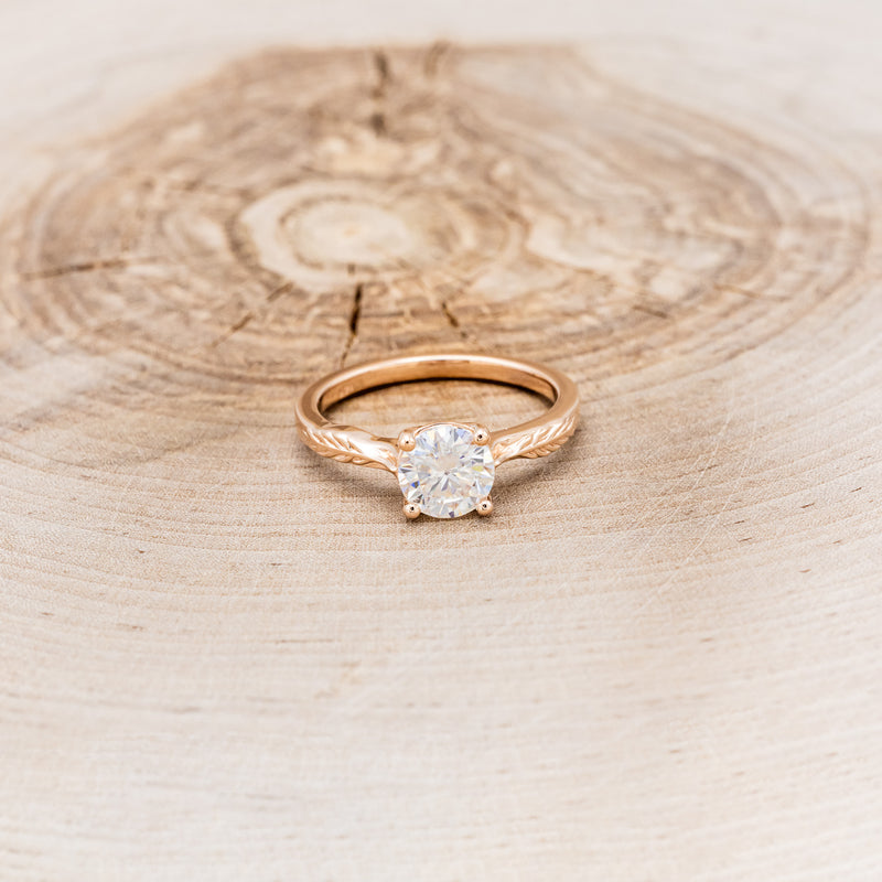 "HOPE" - ROUND CUT MOISSANITE SOLITAIRE ENGAGEMENT RING WITH FEATHER ACCENTS