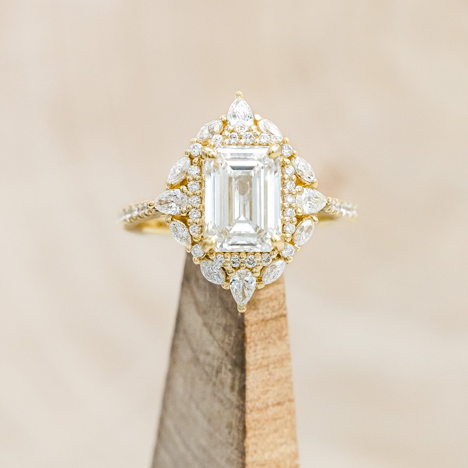 "North Star" - emerald cut diamond women's engagement ring with a diamond halo and accents on a 14K yellow gold band