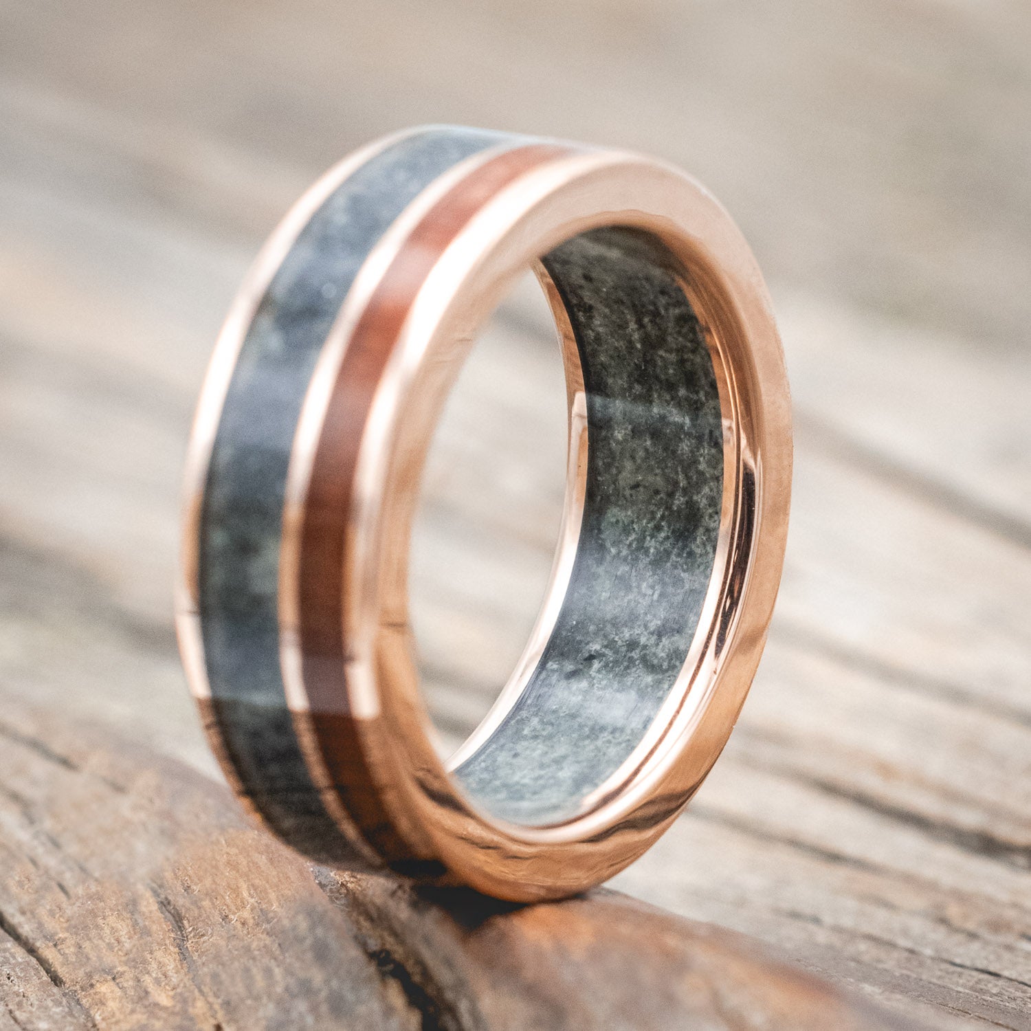"Raptor"- men's wedding ring featuring moss agate and redwood inlays on a moss agate lined band