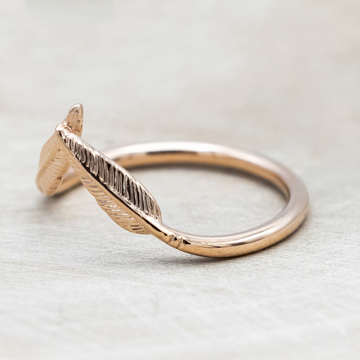 Side view of "Fala" - 14K gold feather-style tracer