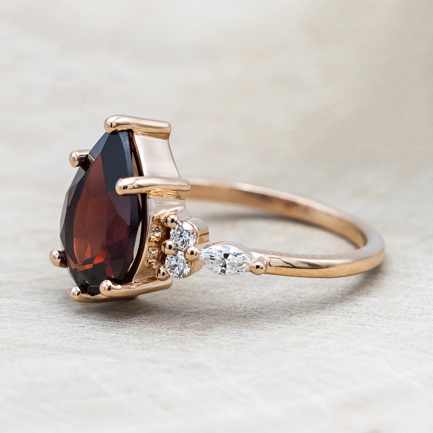 Side view of "Sage" - garnet women's engagement ring with diamond accents