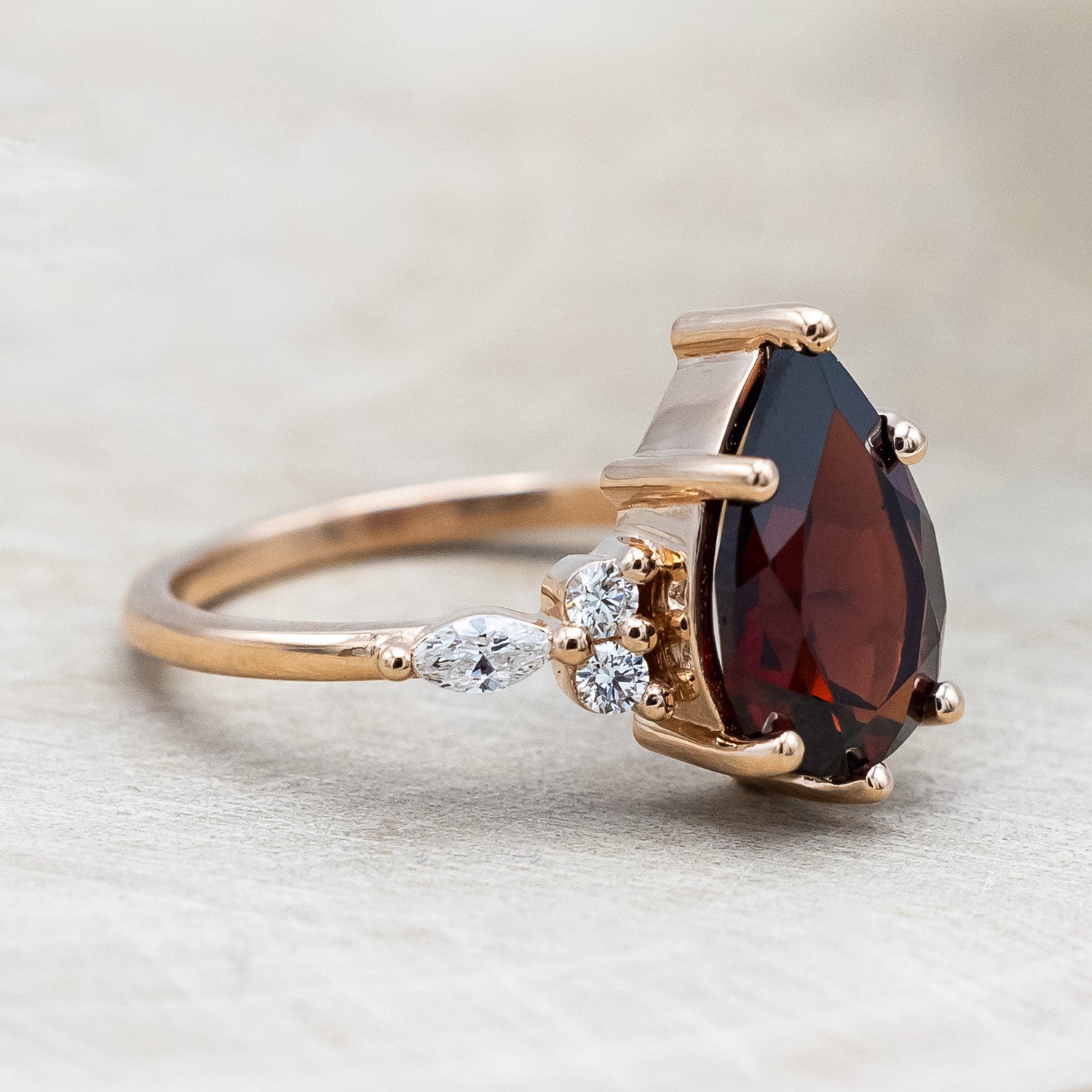 Side view of "Sage" - garnet women's engagement ring with diamond accents