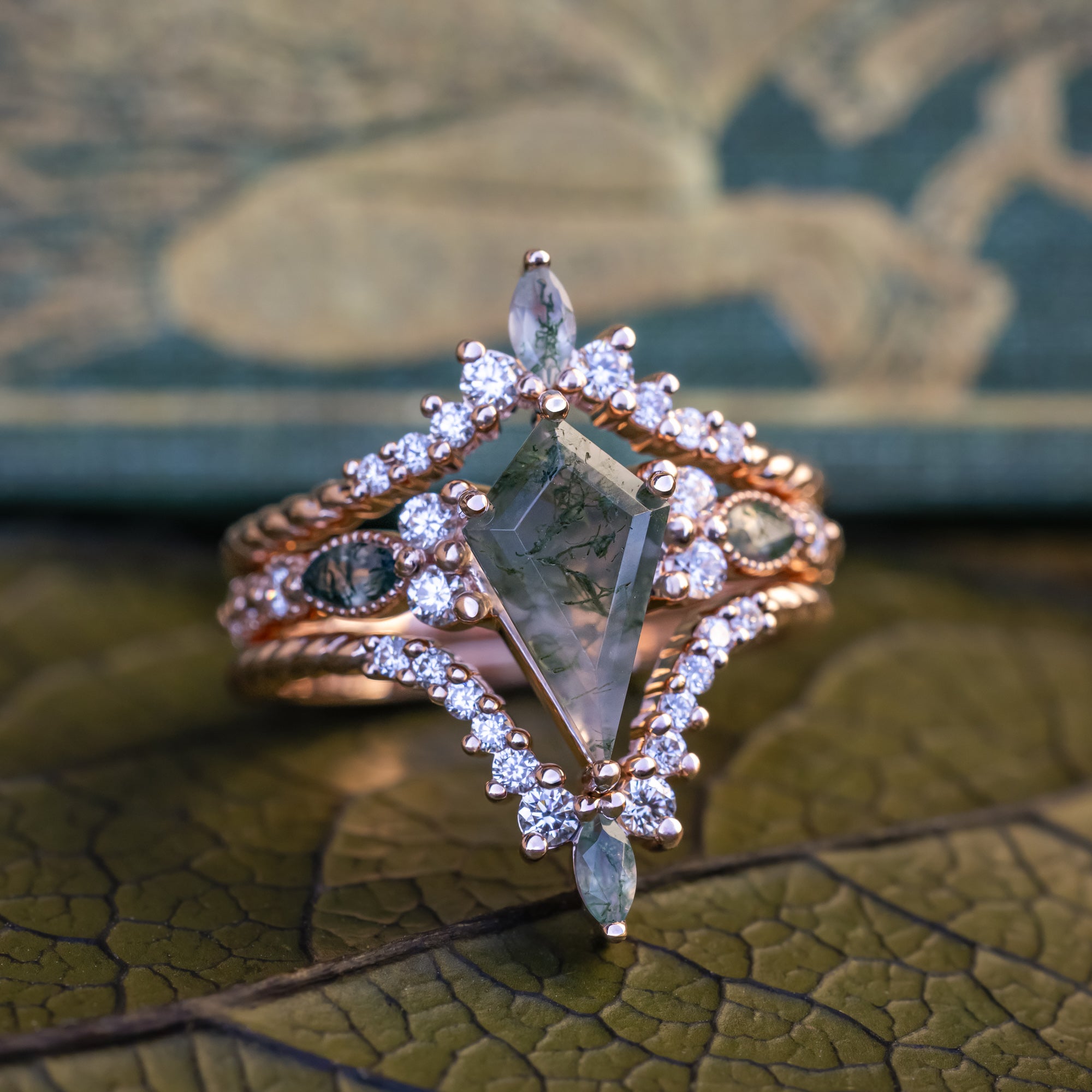 "Shimmering Sage" - Bridal Suite - Kite Cut Moss Agate Engagement Ring With Marquise Moss Agate Accents & A Diamond Tracer-Staghead Designs