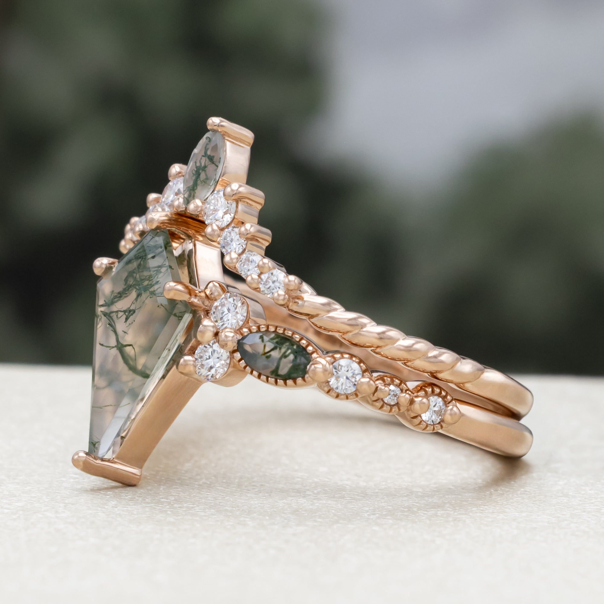 "Shimmering Sage" - Bridal Suite - Kite Cut Moss Agate Engagement Ring With Marquise Moss Agate Accents & A Diamond Tracer-Staghead Designs