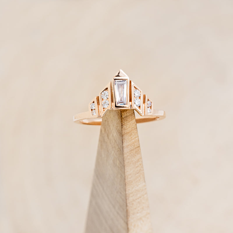 A BEZEL SET TAPERED MOISSANITE TRACER