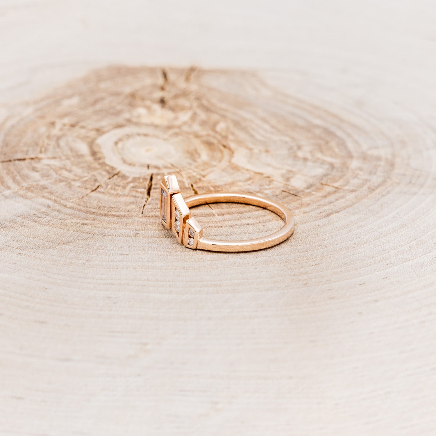 A BEZEL SET TAPERED MOISSANITE TRACER-3