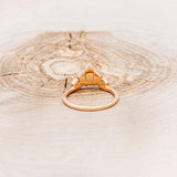 A BEZEL SET TAPERED MOISSANITE TRACER-5