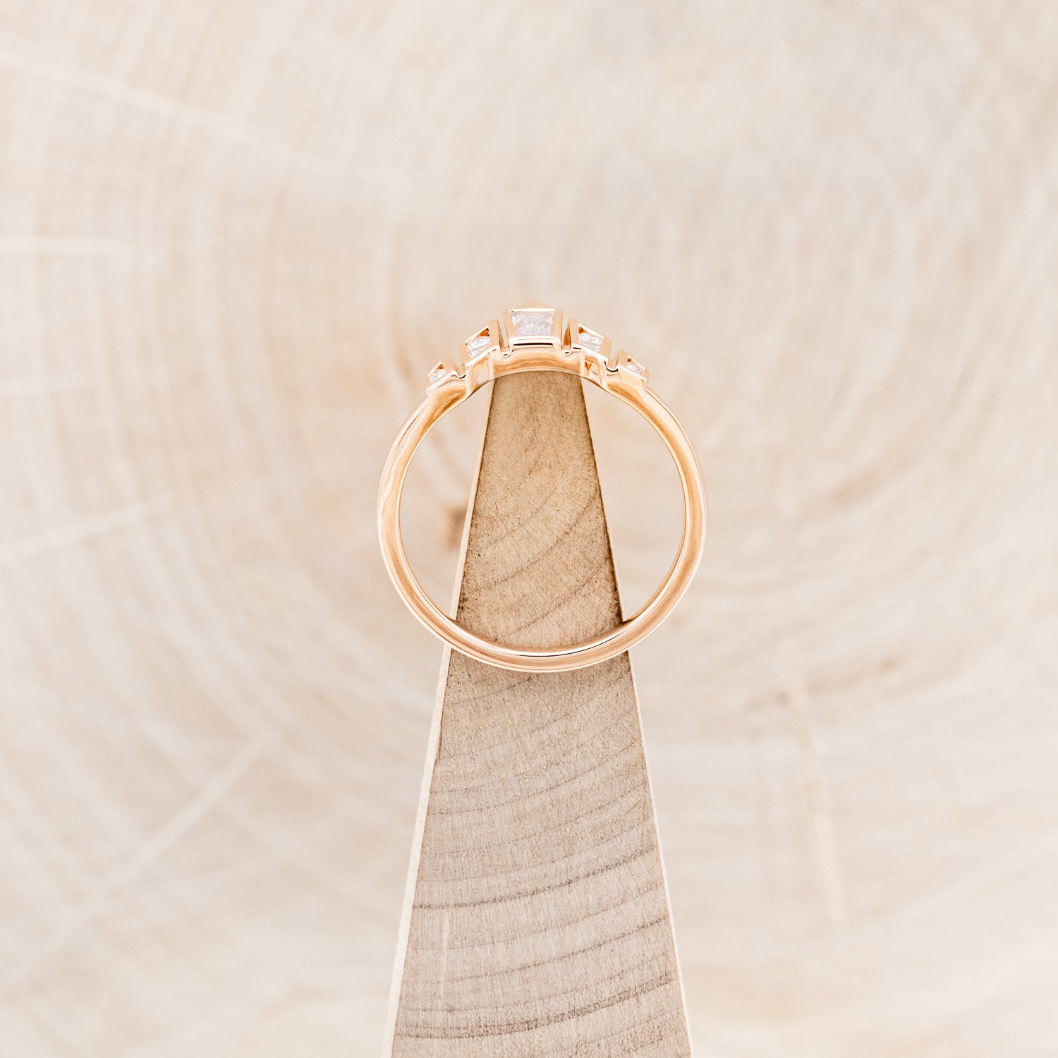 A BEZEL SET TAPERED MOISSANITE TRACER-6