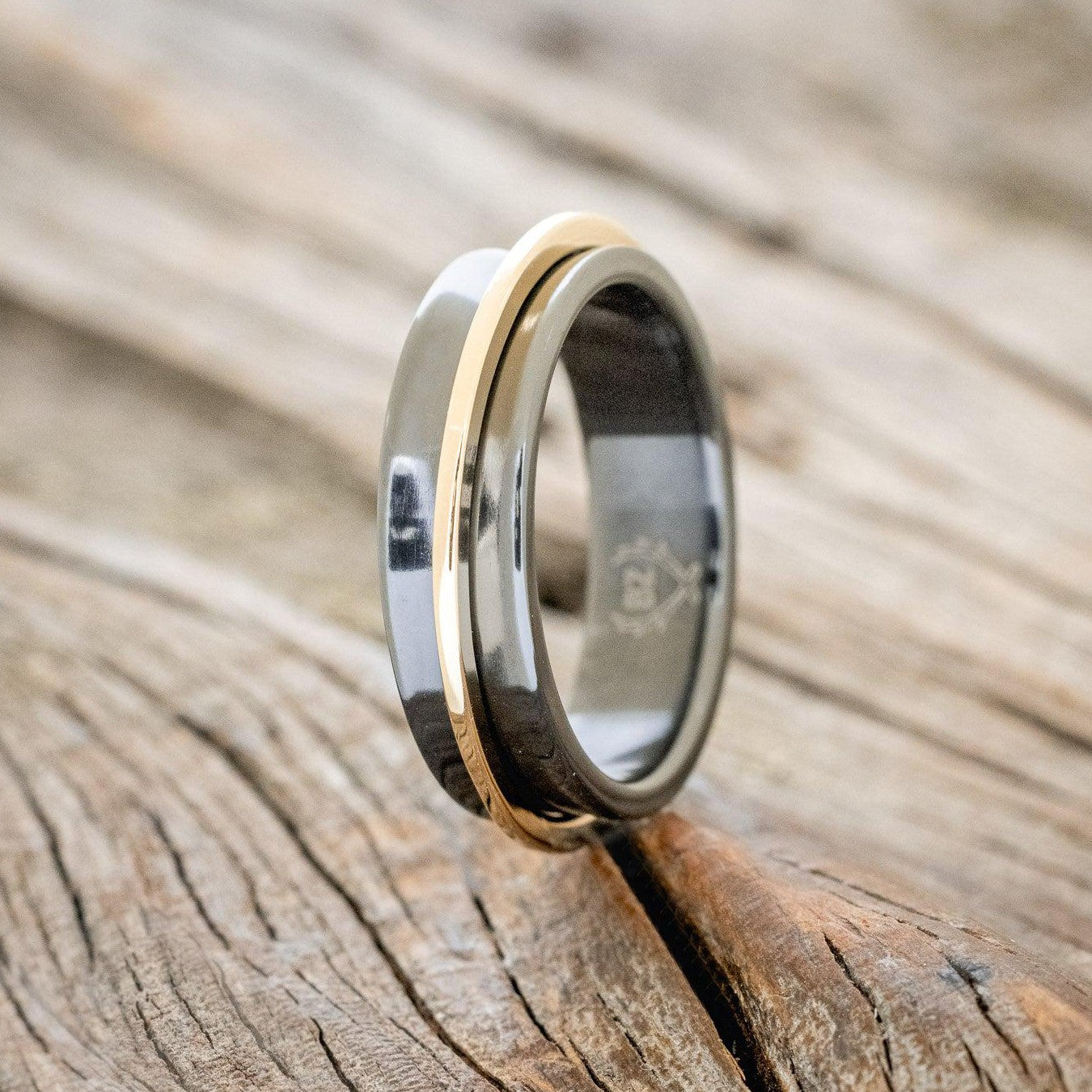 "ROTARY" - 14K GOLD SPINNER WEDDING RING FEATURING A CONCAVE BLACK ZIRCONIUM BAND-1