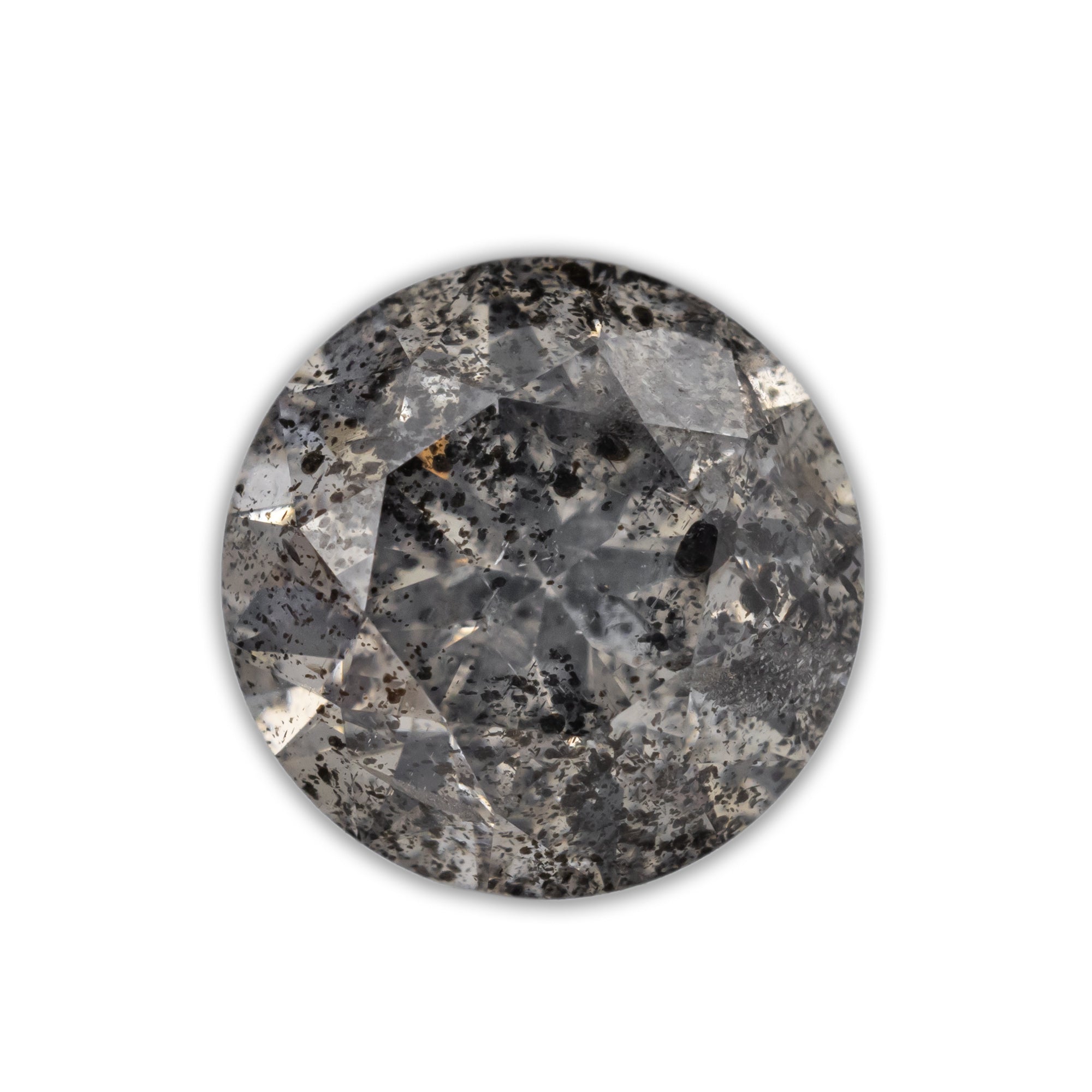 A round salt & pepper diamond with black inclusions on a white background