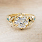 "LUCY IN THE SKY" - ROUND CUT MOISSANITE ENGAGEMENT RING WITH DIAMOND HALO, TURQUOISE INLAYS & DIAMOND TRACER