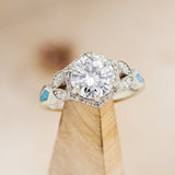 "LUCY IN THE SKY" - ROUND CUT MOISSANITE ENGAGEMENT RING WITH DIAMOND HALO, TURQUOISE INLAYS & DIAMOND TRACER
