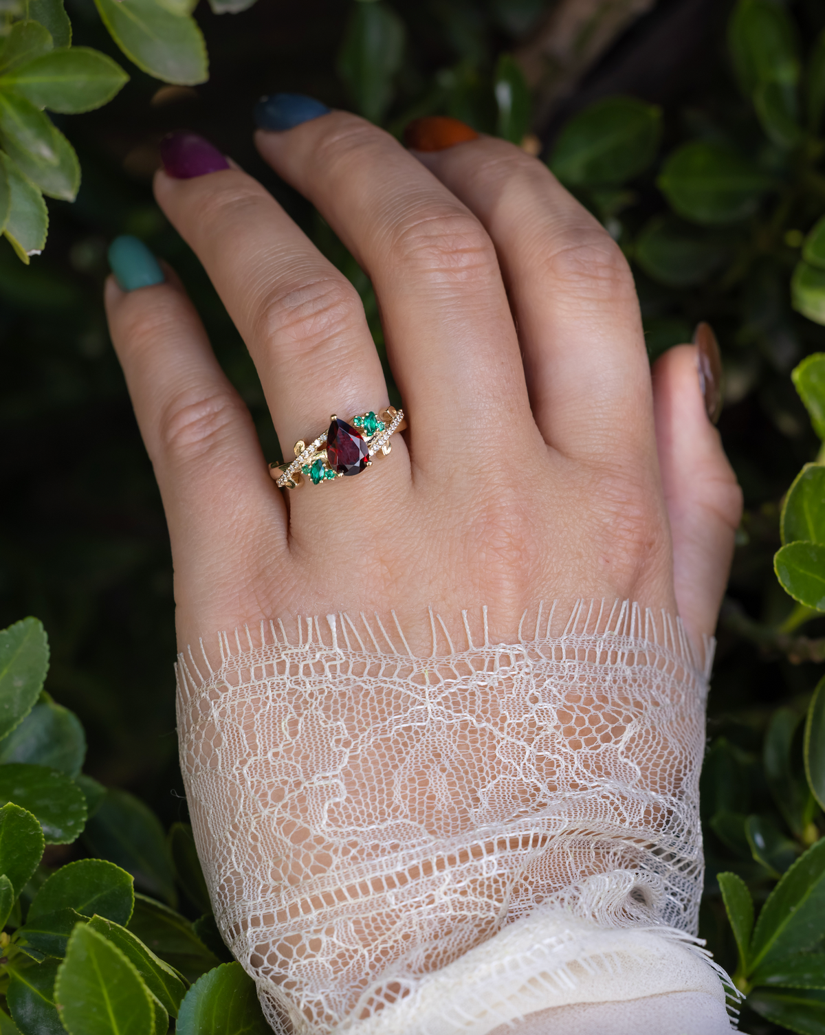 "Kamila" - Pear Cut Mozambique Garnet Engagement Ring With Lab-Grown Emerald & Diamond Accents-Staghead Designs