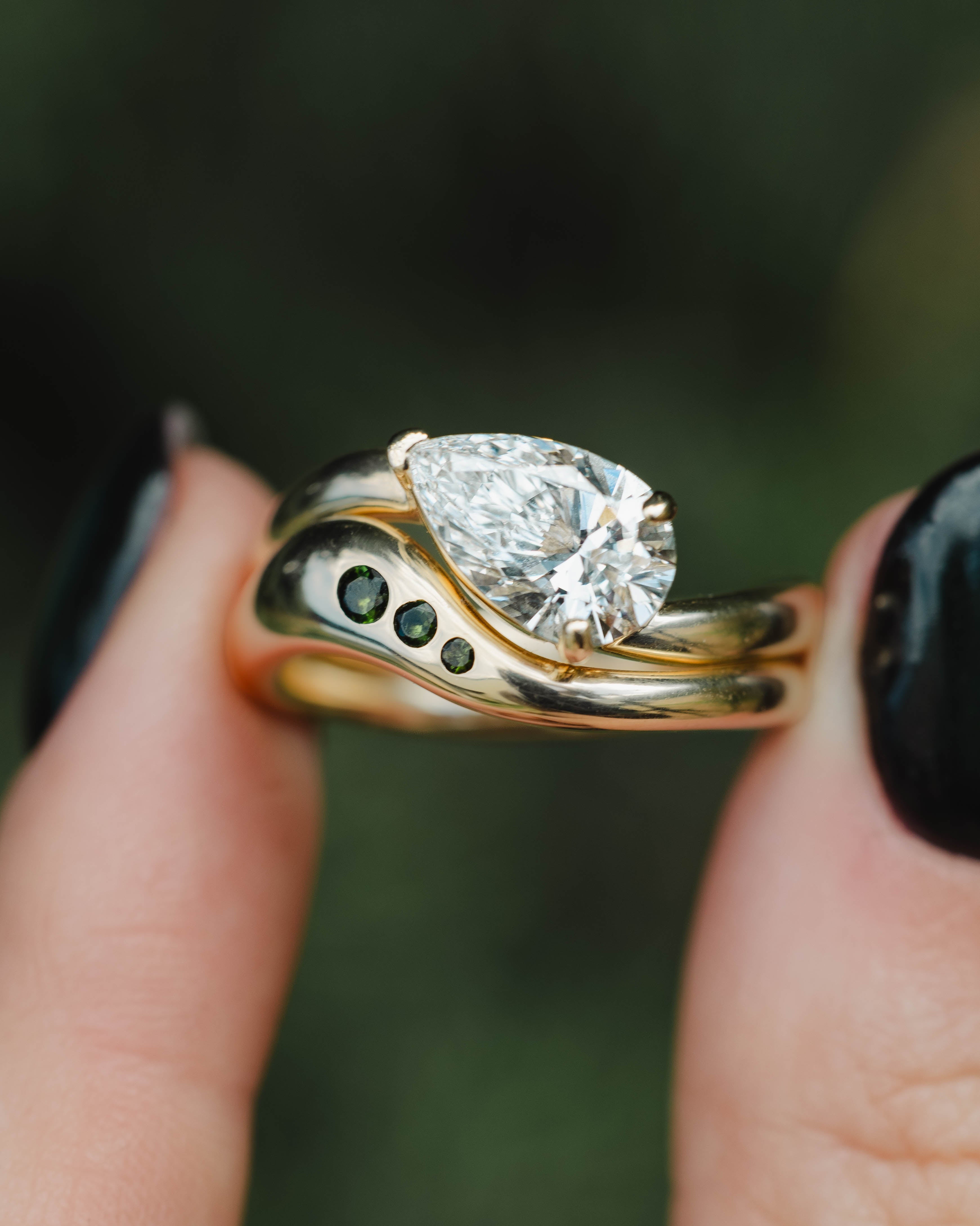 "SYBIL" - ASYMMETRICAL PEAR CUT MOISSANITE ENGAGEMENT RING WITH A GREEN TOURMALINE ACCENTED TRACER-Staghead Designs