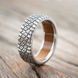 "PARCEL" - CUSTOM EMBOSSED TIRE TREAD WEDDING RING WITH A WHISKEY BARREL LINING