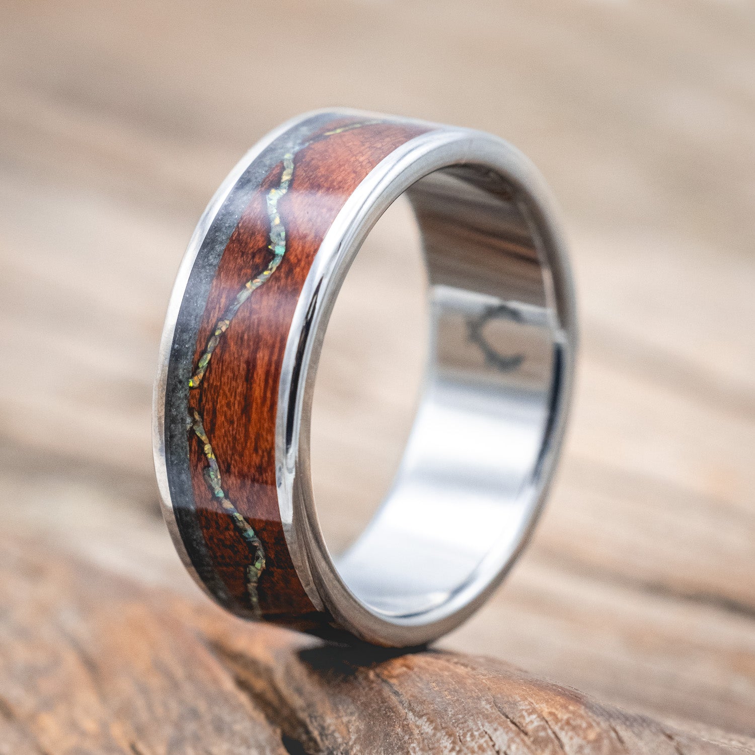 "The Expedition" - men's wedding ring featuring a mountain engraving with fire & ice opal, rosewood, and moss agate inlays