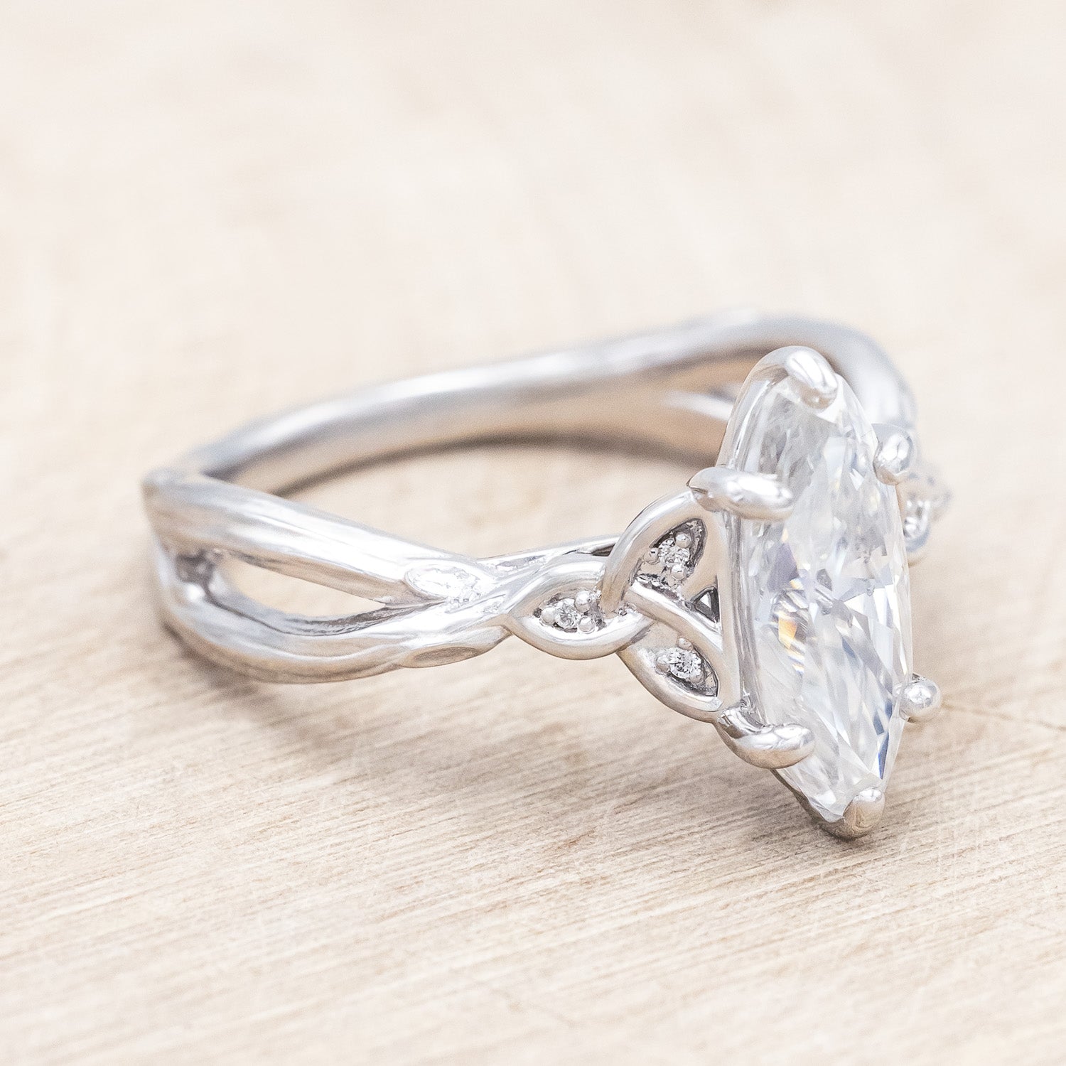 Side view of "Amaris" - Celtic knot-style Moissanite women's engagement ring with diamond accents