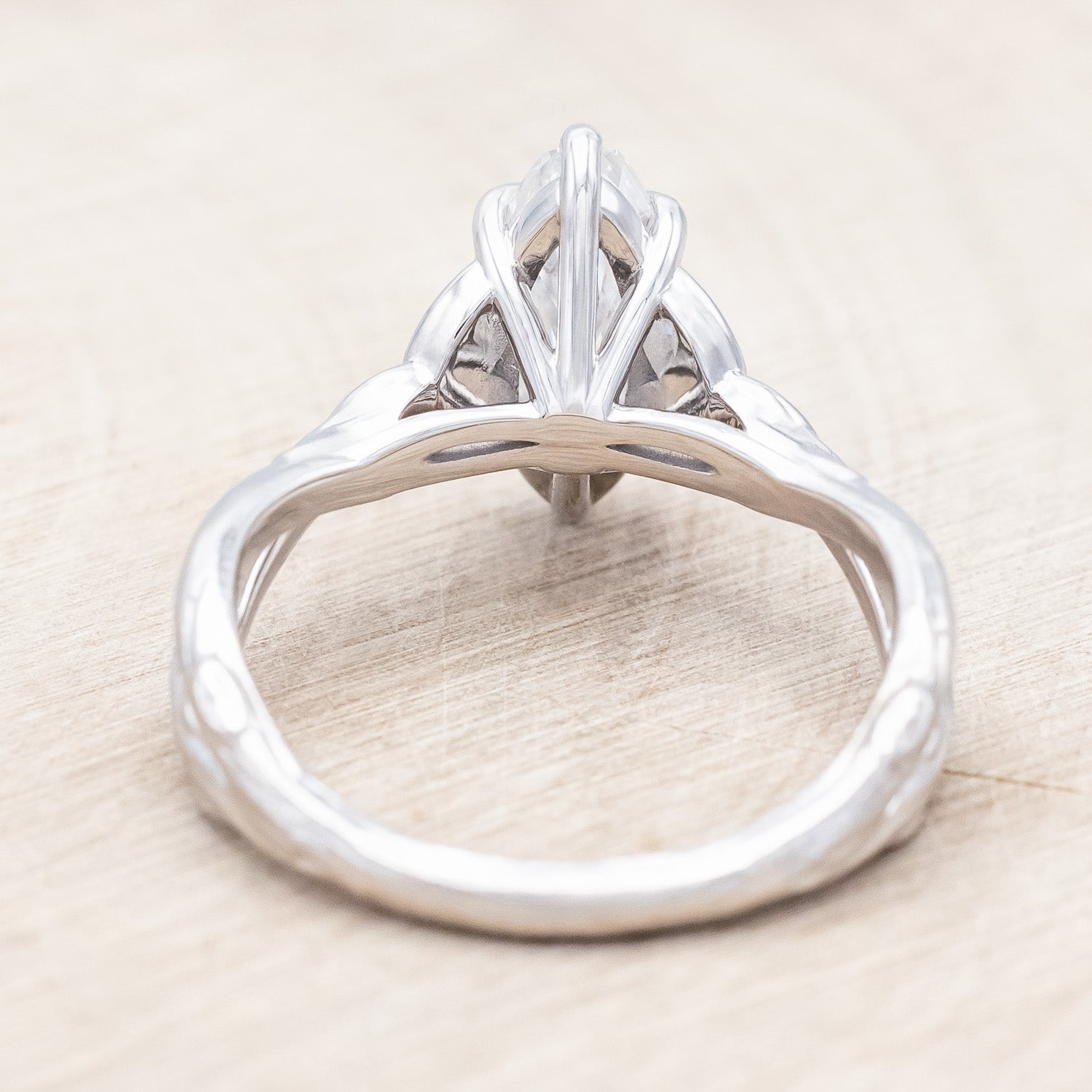 Back view of "Amaris" - Celtic knot-style Moissanite women's engagement ring with diamond accents