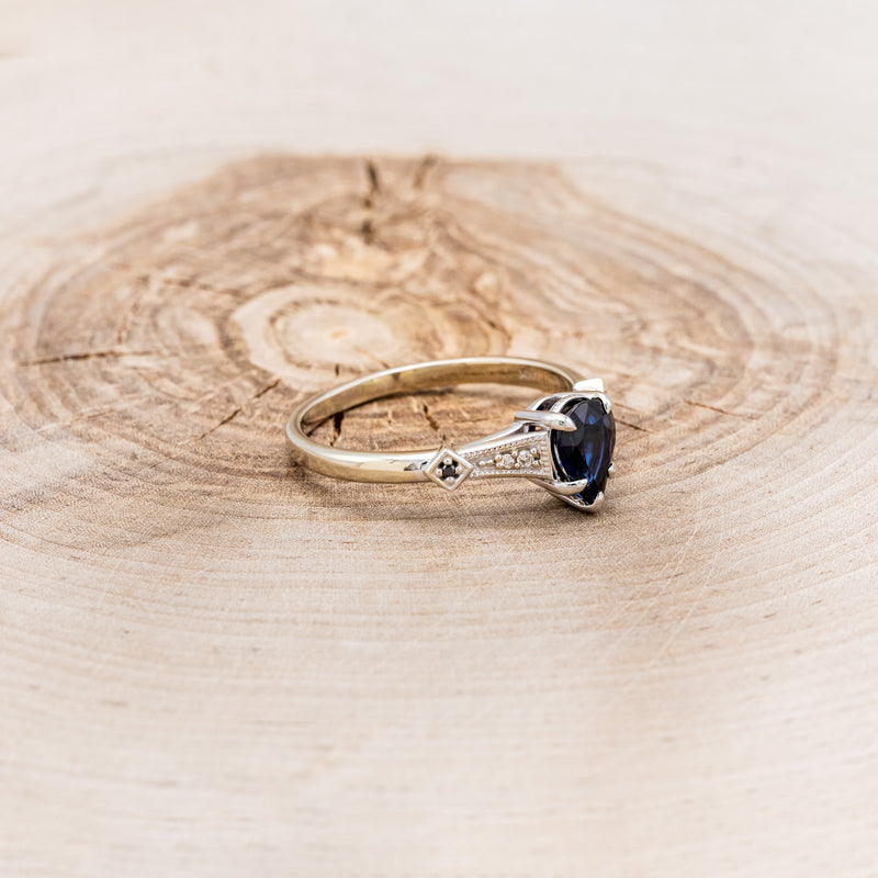 "ANNORA" - PEAR SHAPED LAB-GROWN BLUE SAPPHIRE ENGAGEMENT RING WITH BLACK & WHITE DIAMOND ACCENTS
