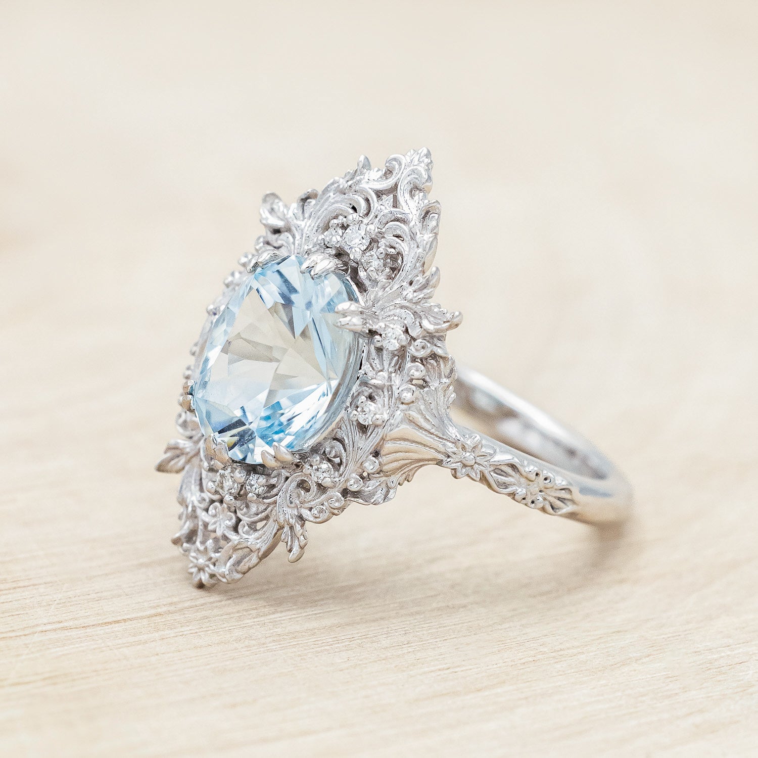 Side view of "Cherie" - sculptural-style aquamarine women's engagement ring with diamond accents