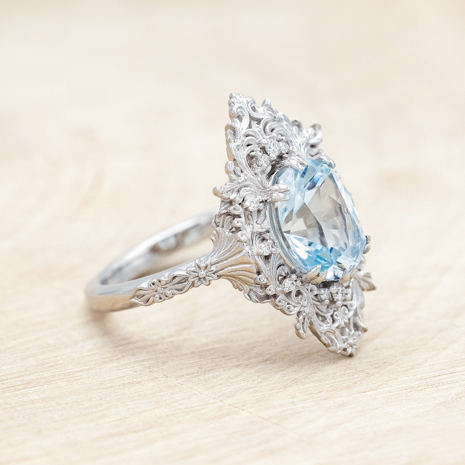 Side view of "Cherie" - sculptural-style aquamarine women's engagement ring with diamond accents