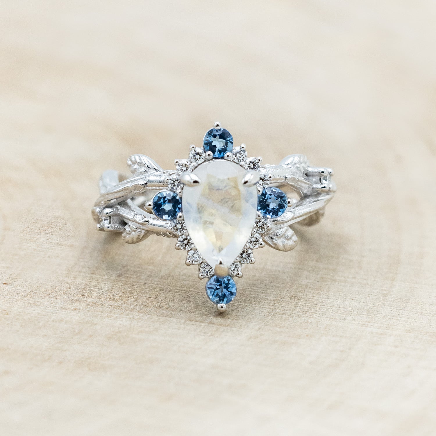 "ARTEMIS ON THE VINE DIVINE" - PEAR CUT MOONSTONE ENGAGEMENT RING WITH DIAMOND & AQUAMARINE ACCENTS IN A BRANCH-STYLE BAND-Staghead Designs