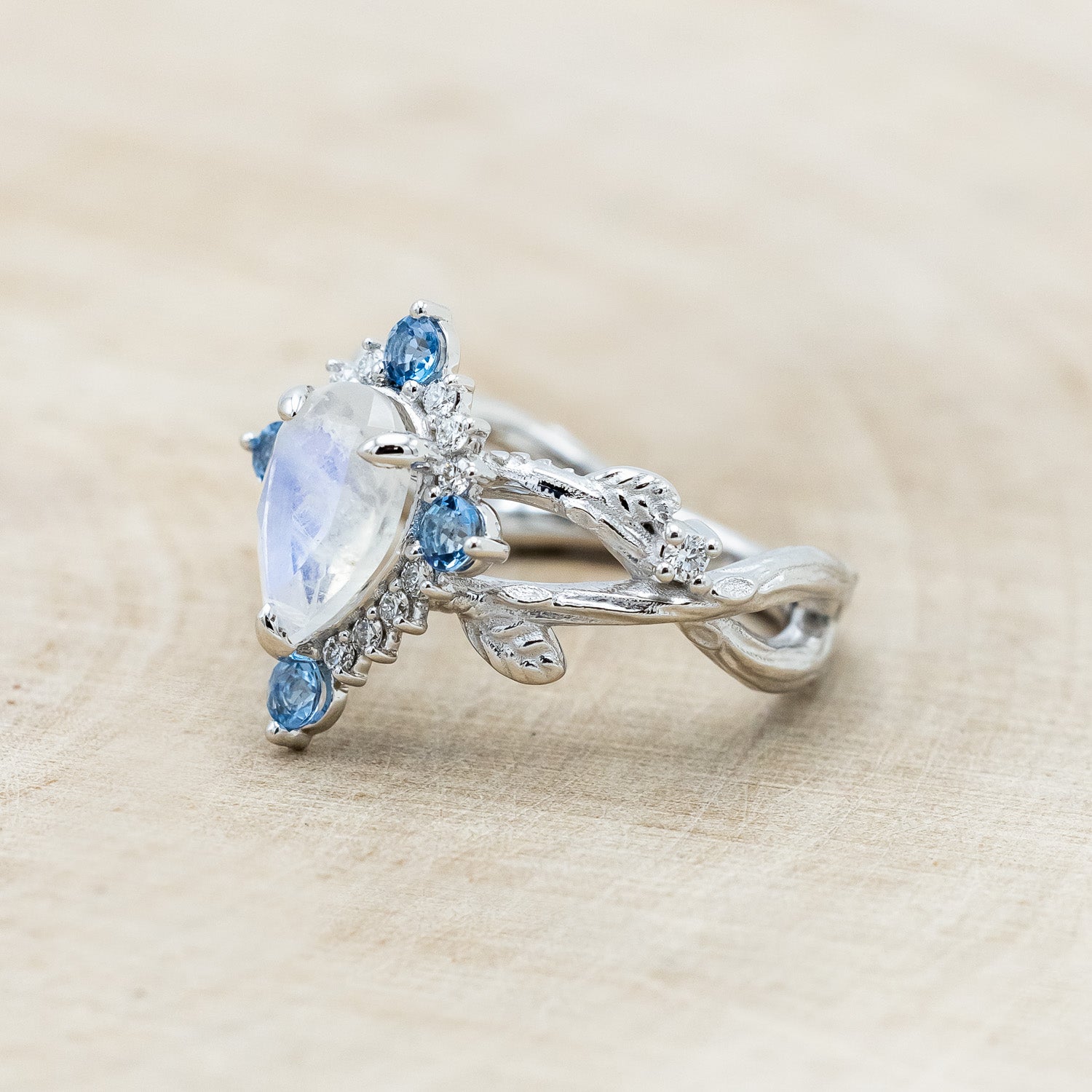 "ARTEMIS ON THE VINE DIVINE" - PEAR CUT MOONSTONE ENGAGEMENT RING WITH DIAMOND & AQUAMARINE ACCENTS IN A BRANCH-STYLE BAND-Staghead Designs