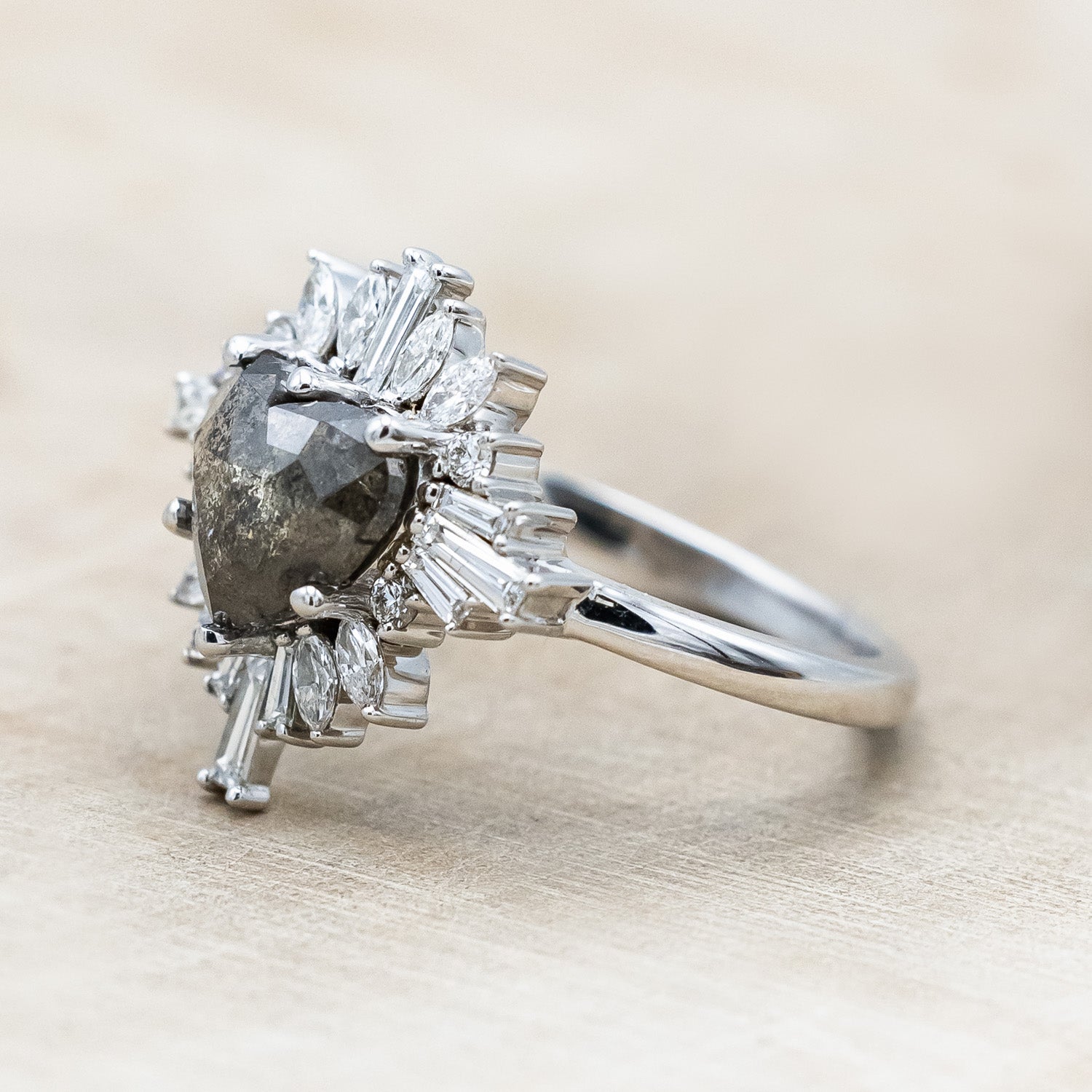 Side view of "Autumn" - women's engagement ring with heart cut salt & pepper diamond and diamond halo in 14K white gold