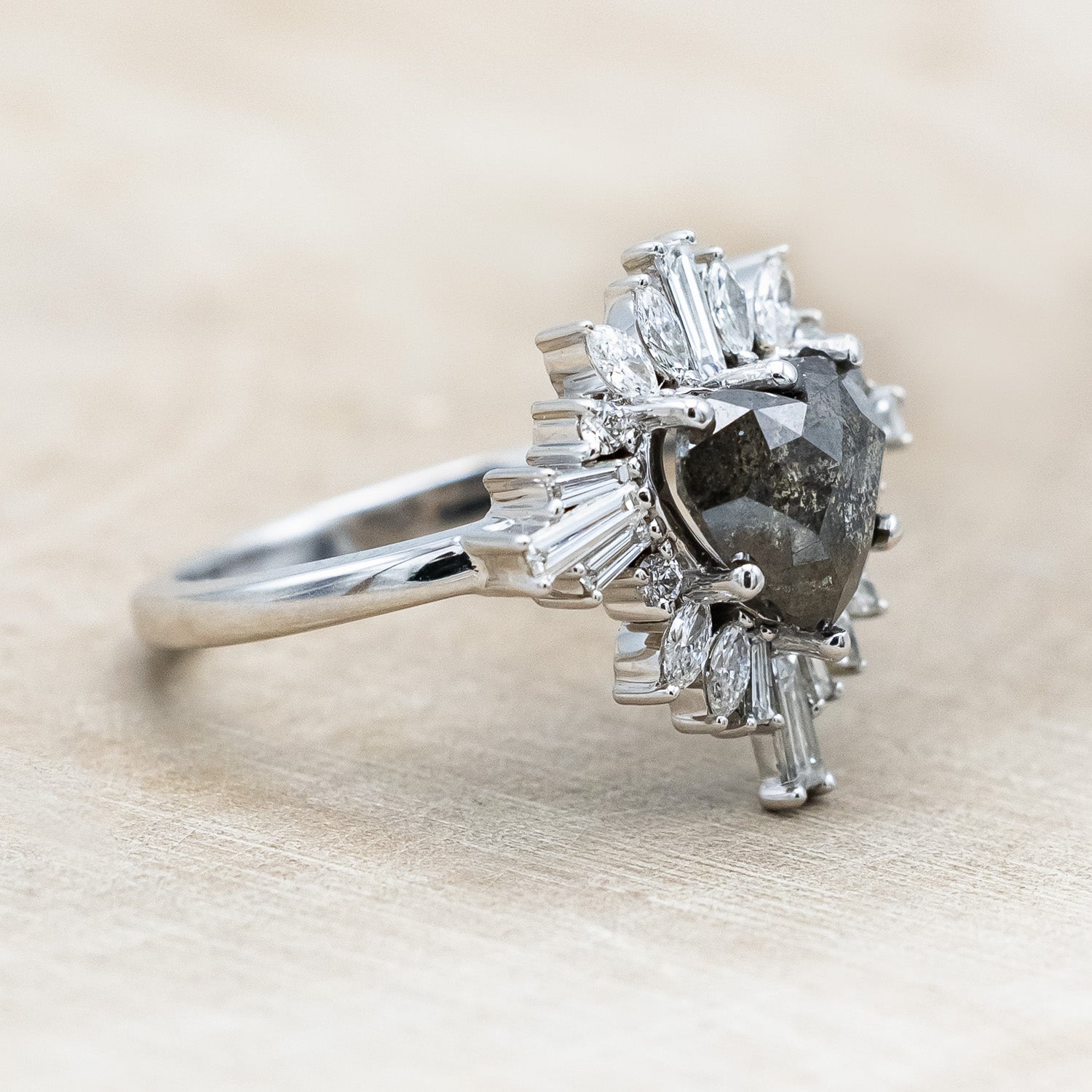 Side view of "Autumn" - women's engagement ring with heart cut salt & pepper diamond and diamond halo in 14K white gold