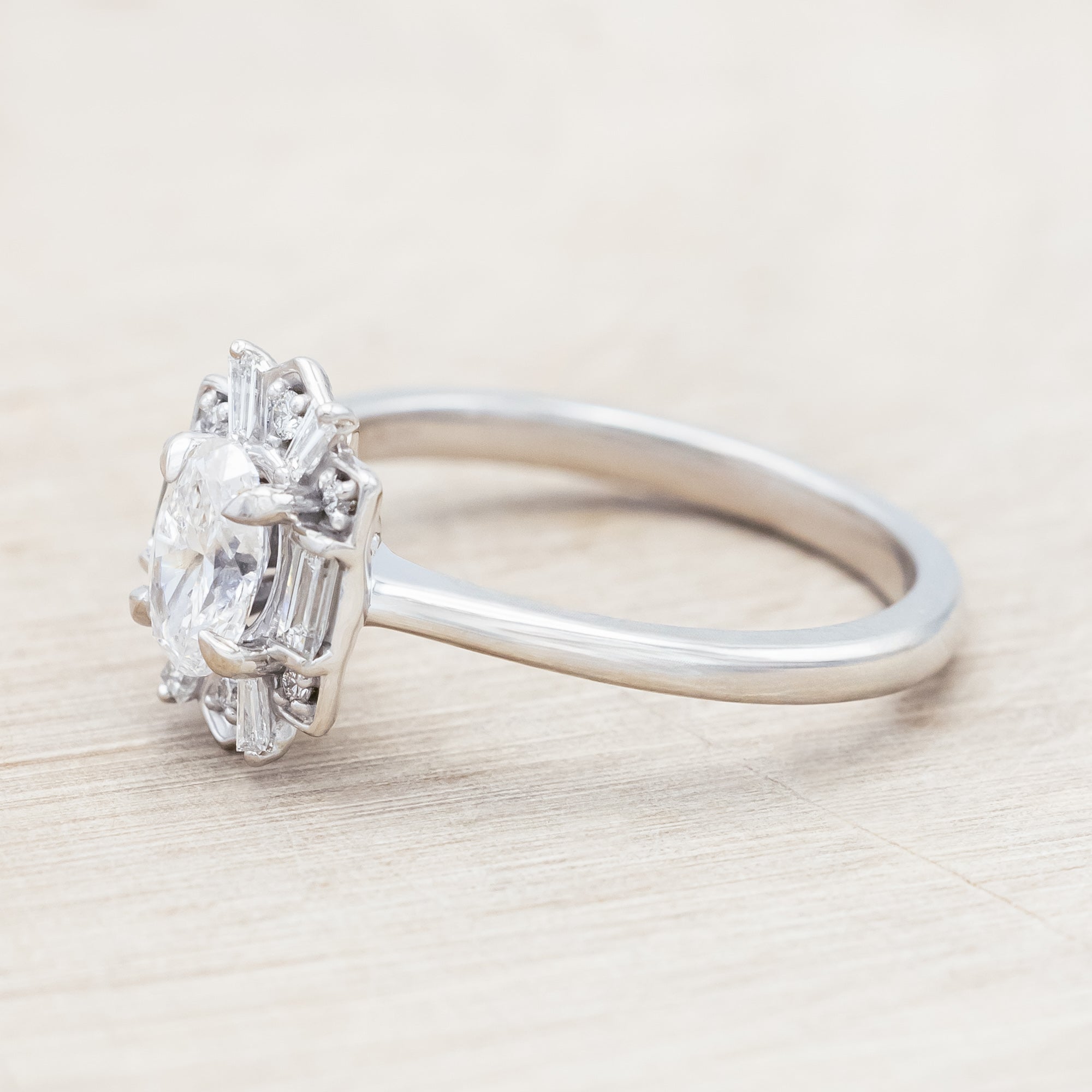 Lab diamond ring with genuine diamond accents against beige background